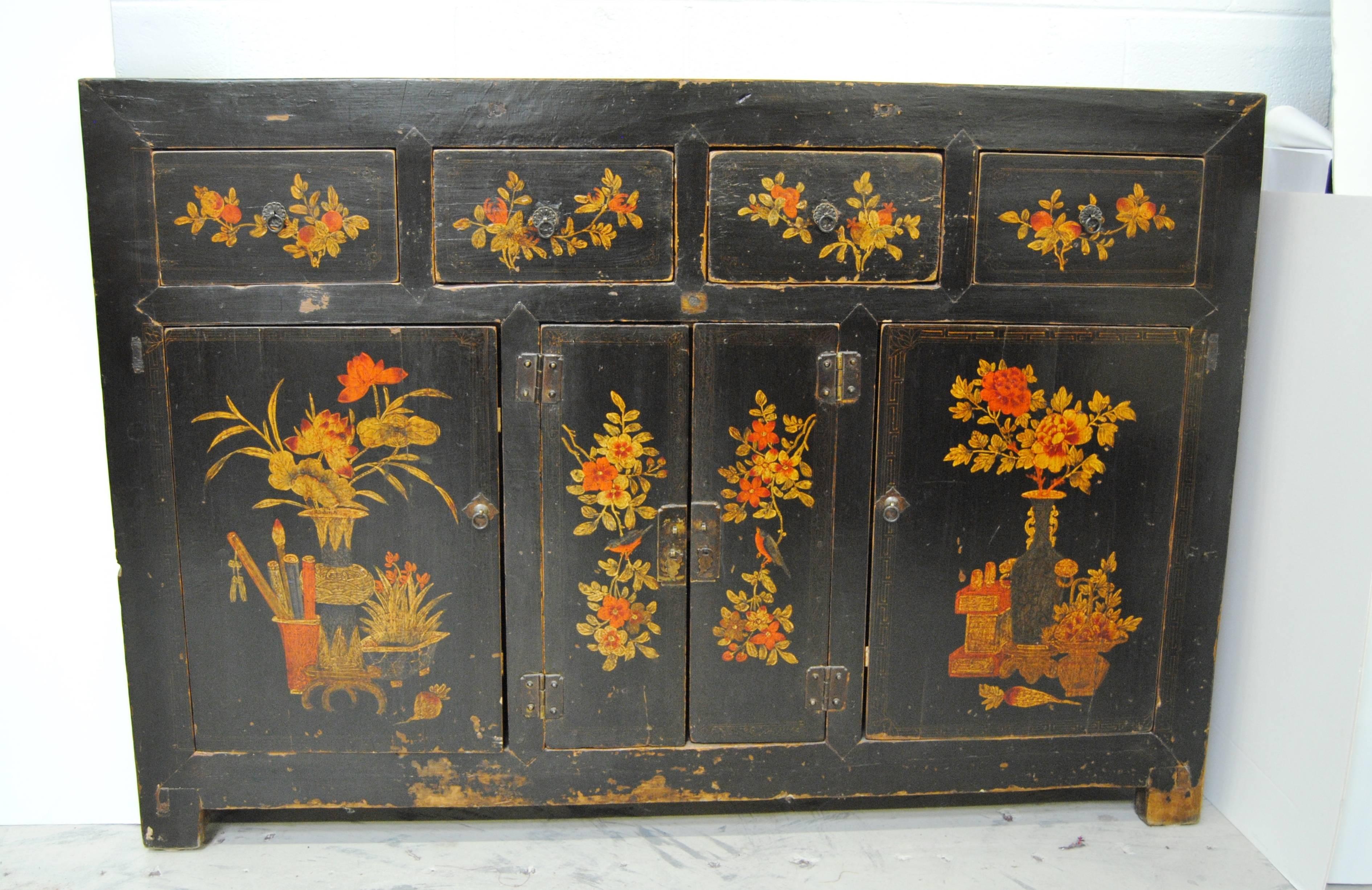 Large antique elmwood Manchurian cabinet with original floral design and lacquer. This very heavy Asian cabinet has excellent storage with an inner shelf. A beautiful cabinet that would mix well with English antiques or contemporary pieces.