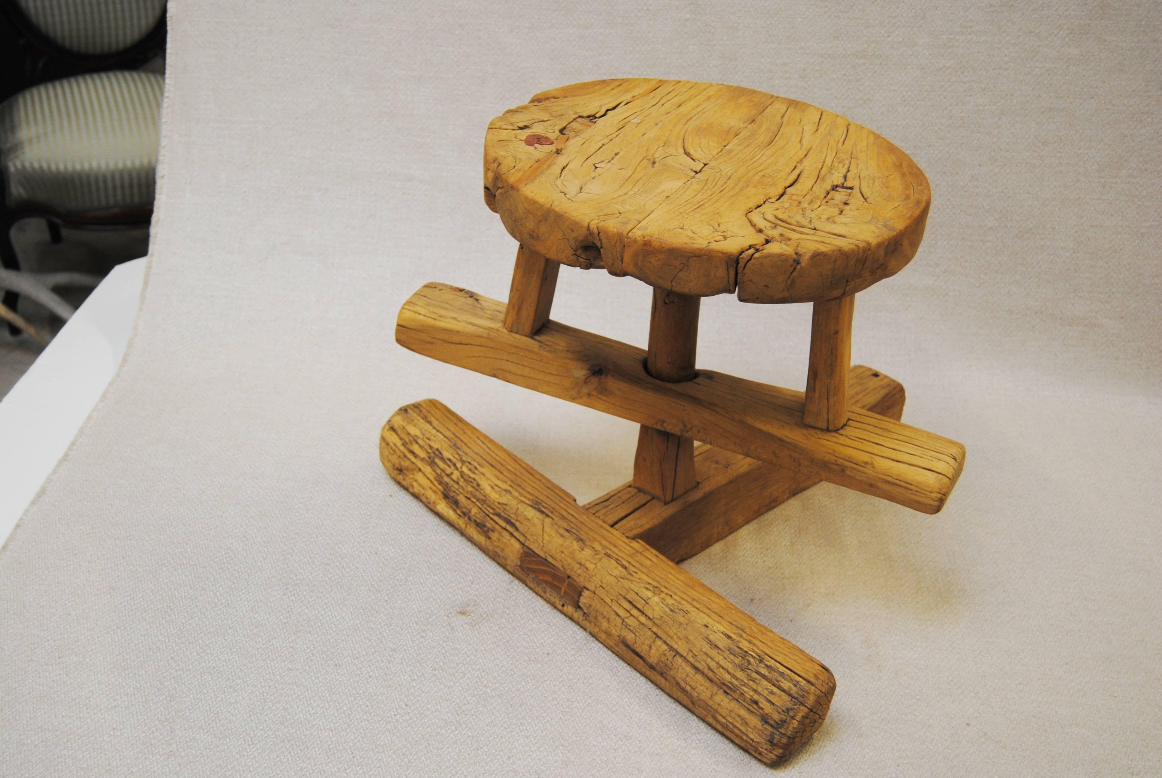 Antique Chinese elmwood potter's stool. Two parts, revolving top fits into the T-base. The old elmwood shows great character with its deep grain. A great piece of folk art.