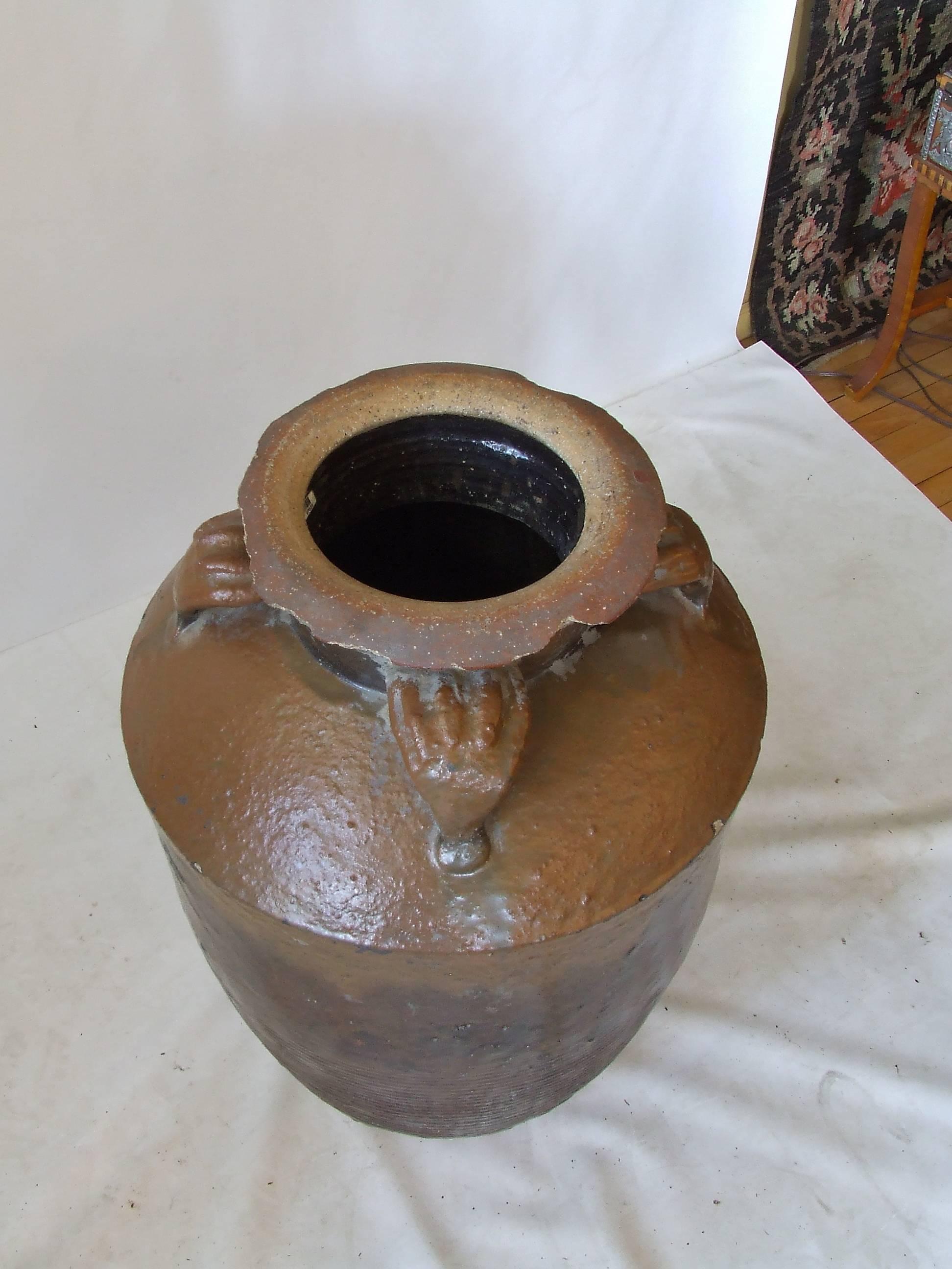 Large, very heavy antique Chinese stoneware pot from Shanxi Province, circa 1900. The original glaze and finish are in very good condition for the age of the piece. Beautiful display piece.