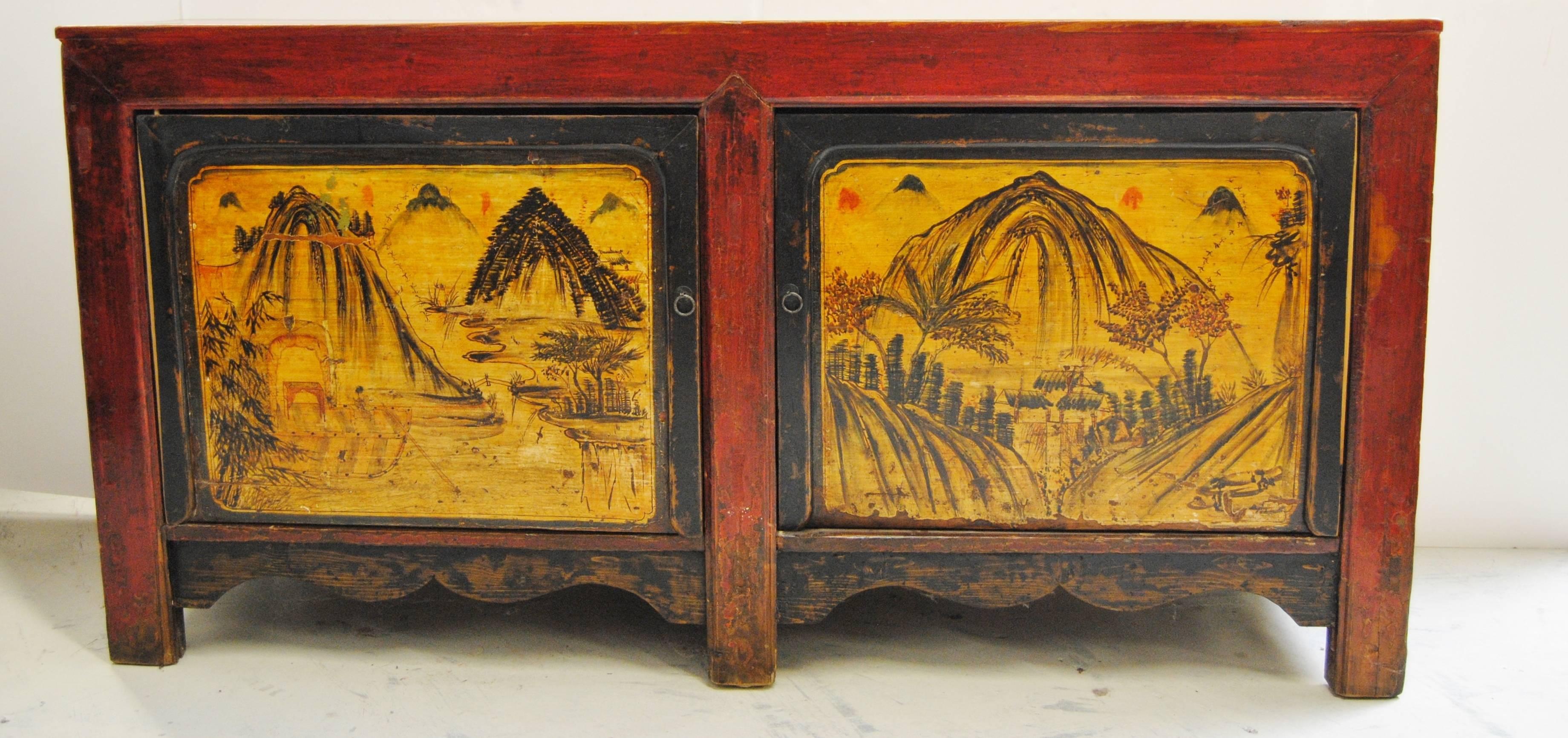 Double bay antique Western Chinese elmwood cabinet with original artwork. Colors are strong and vibrant with striking scenes. The cabinet has good storage with a newly added center shelf.  