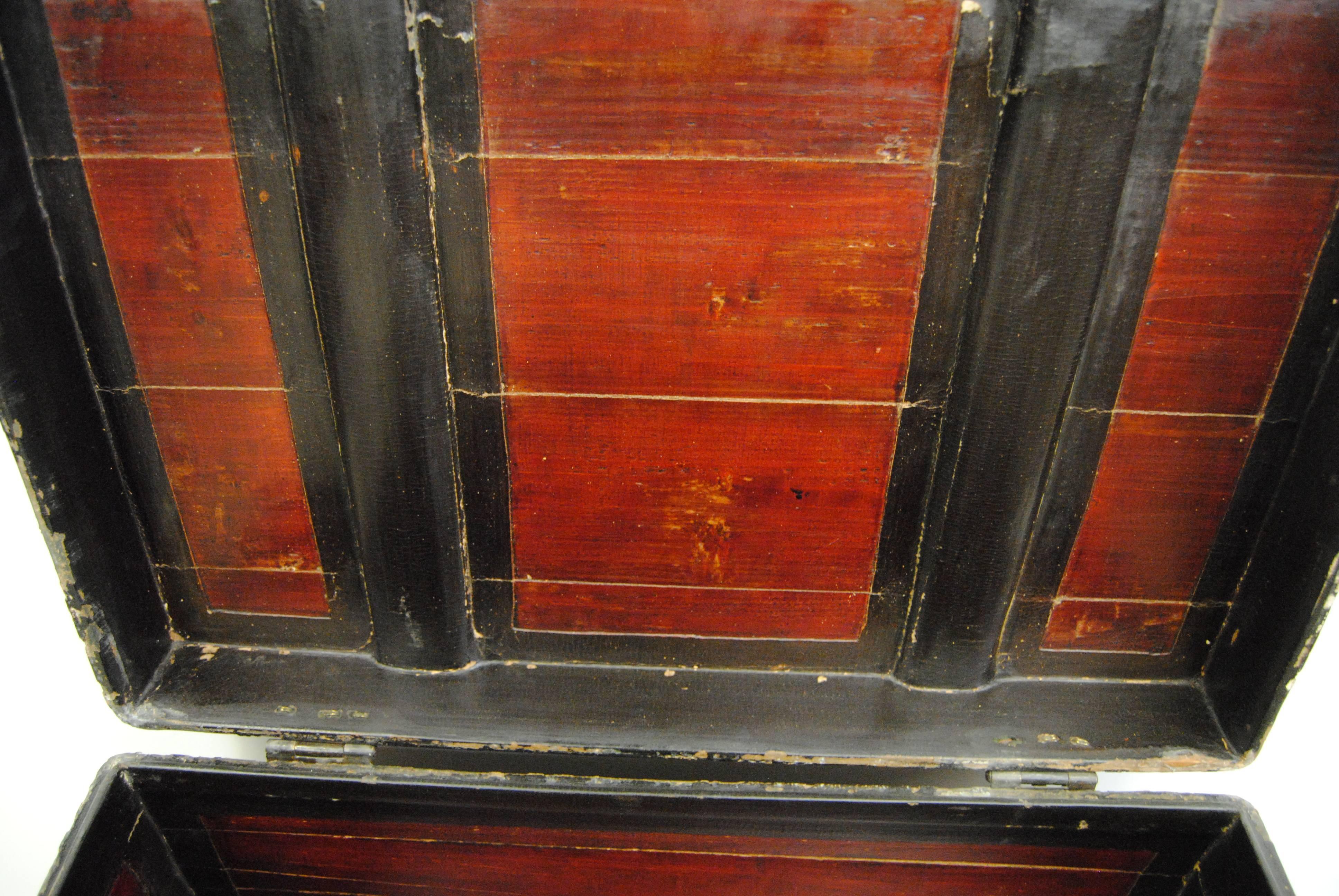 Antique Chinese trunk, circa late 19th century. Woven willow side panels with hand-carved lower wood trim with original red and black lacquer. Hand-forged iron hardware. Top is well worn. Wooden interior color is strong and in good condition. An