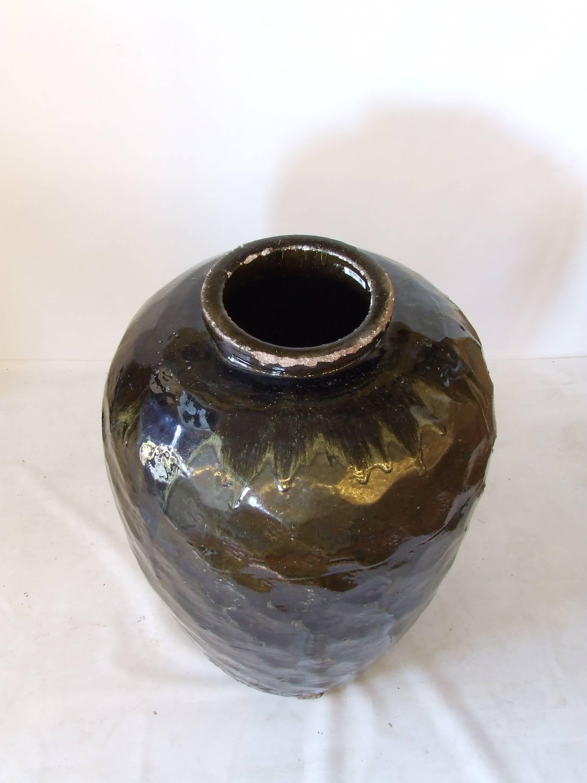 Extra large antique Chinese stoneware pot from western China. The large Asian Pot has beautiful original glaze and finish with minimal age appropriate wear. Originally used to store water for a home. Perfect for an entry or solarium.