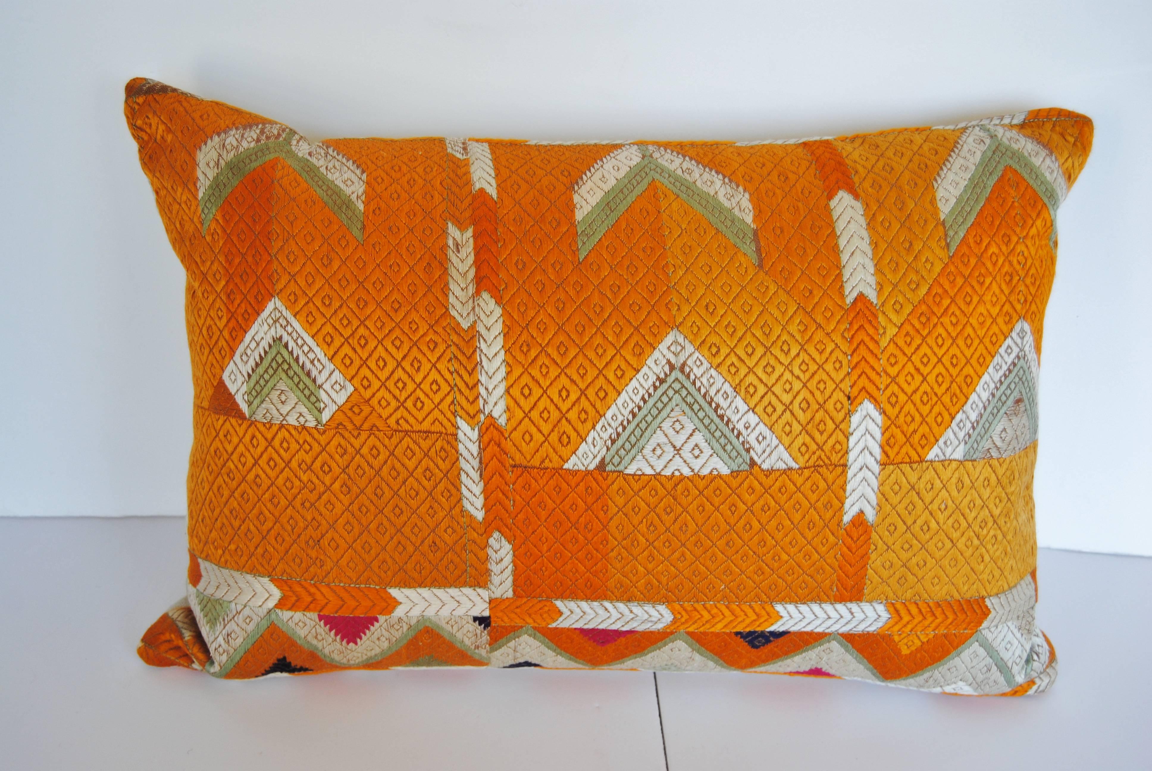 Custom pillow cut from a vintage Phulkari Bagh wedding shawl from Punjab, India. Hand embroidered in vibrant silk threads by the bride's family for her wedding. The pillow is backed in ivory silk, filled with an insert of 50/50 down and feathers and