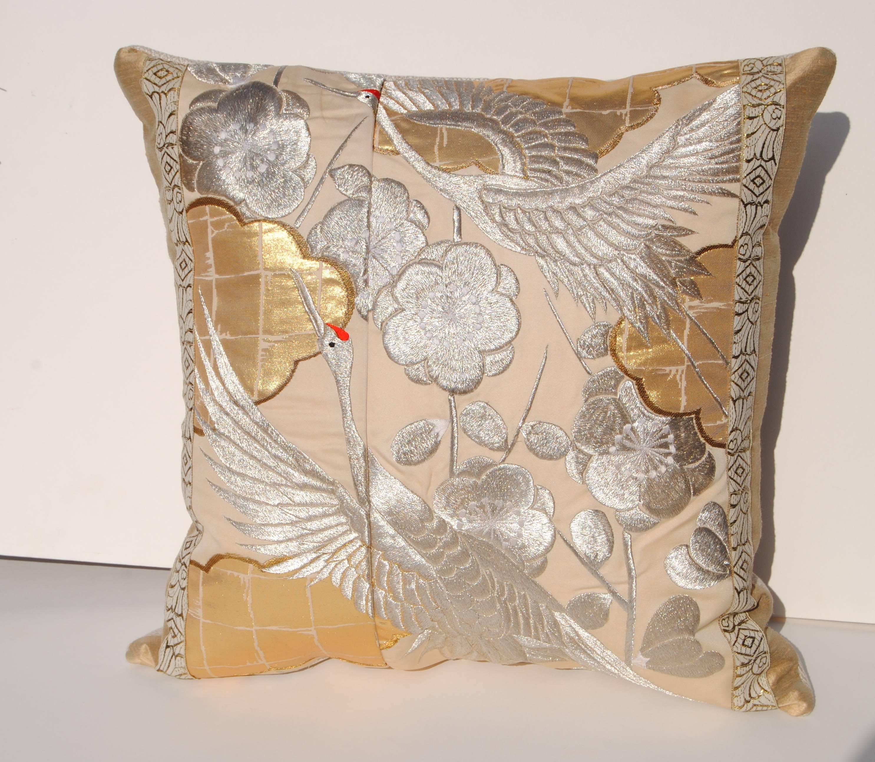 Two custom pillows cut from a vintage silk Japanese wedding kimono.  Exquisite silk embroidery in silver and white.  Pillows are faced with a beige silk and backed in cream linen.  They are filled with an insert of 50/50 down and feathers and hand