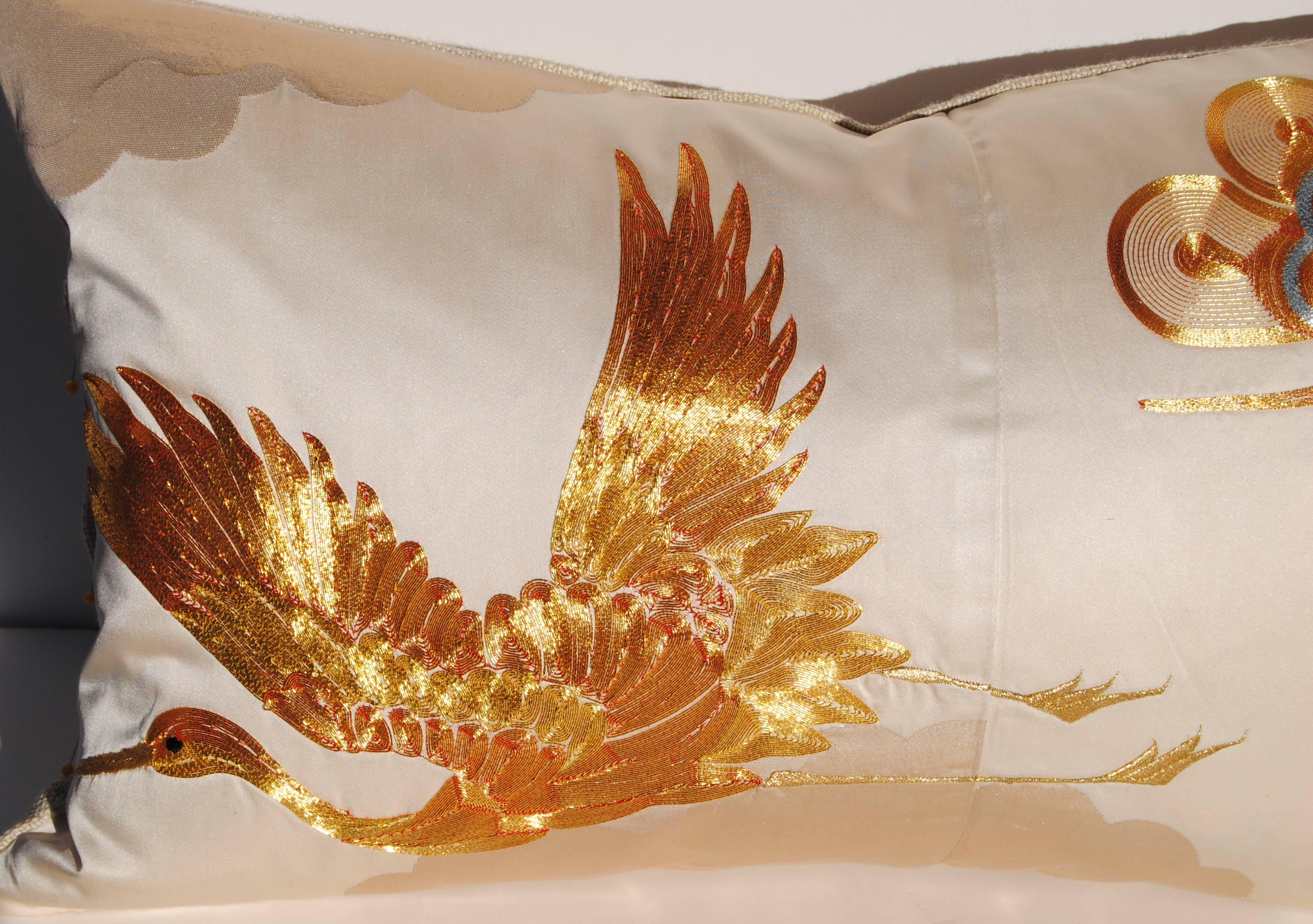 Custom pillow cut from a vintage embroidered silk Japanese uchikake wedding kimono. The creamy white silk is embroidered with gold and silver metallic threads. The pillow is backed with an off-white linen, filled with an insert of 50/50 down and