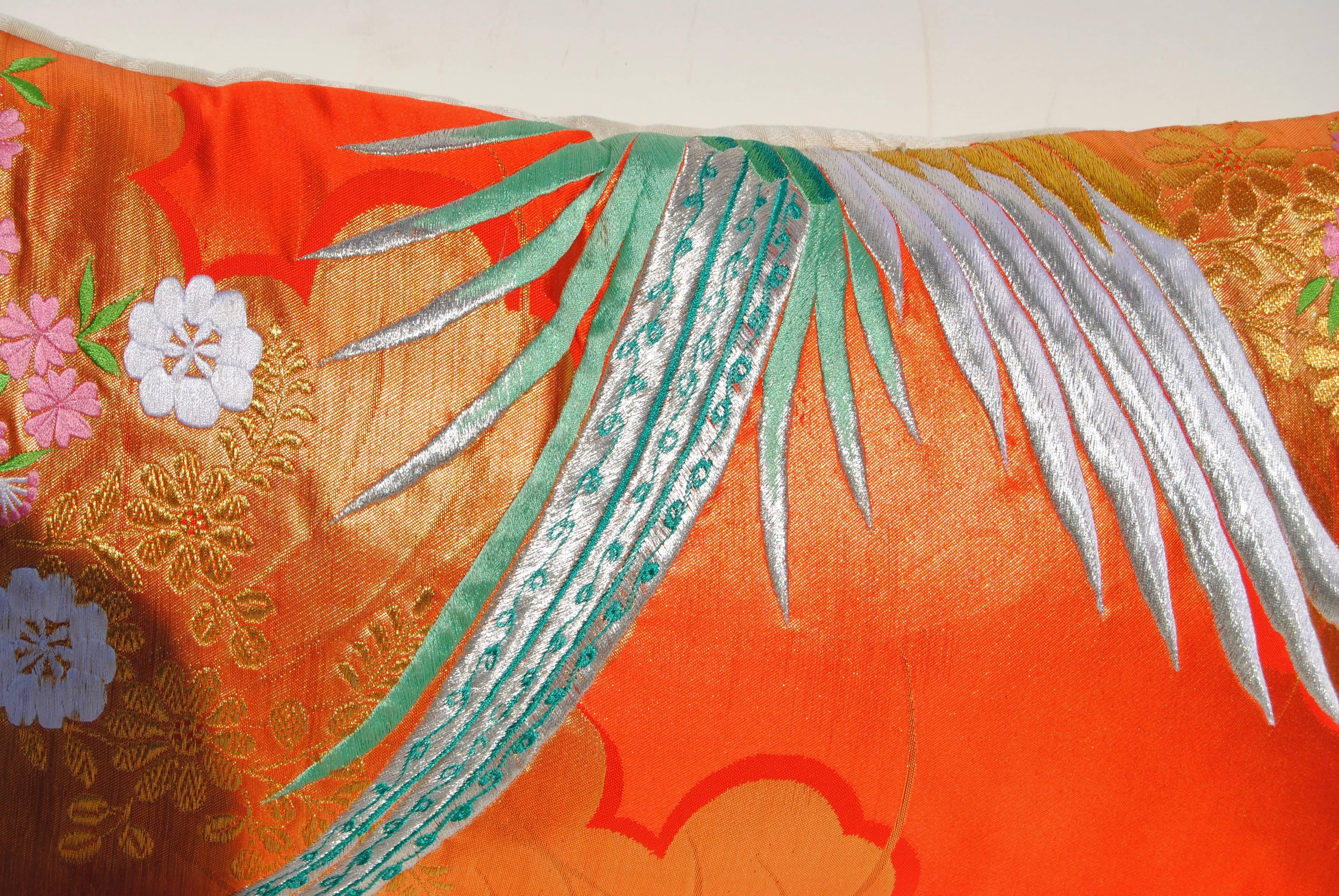 Custom pillow cut from a vintage Japanese silk uchikake, the traditional wedding kimono. The silk is embroidered with metallic and silk threads in vibrant colors. Pillow is backed in a Scalamandre silk damask, filled with an insert of 50/50 down and