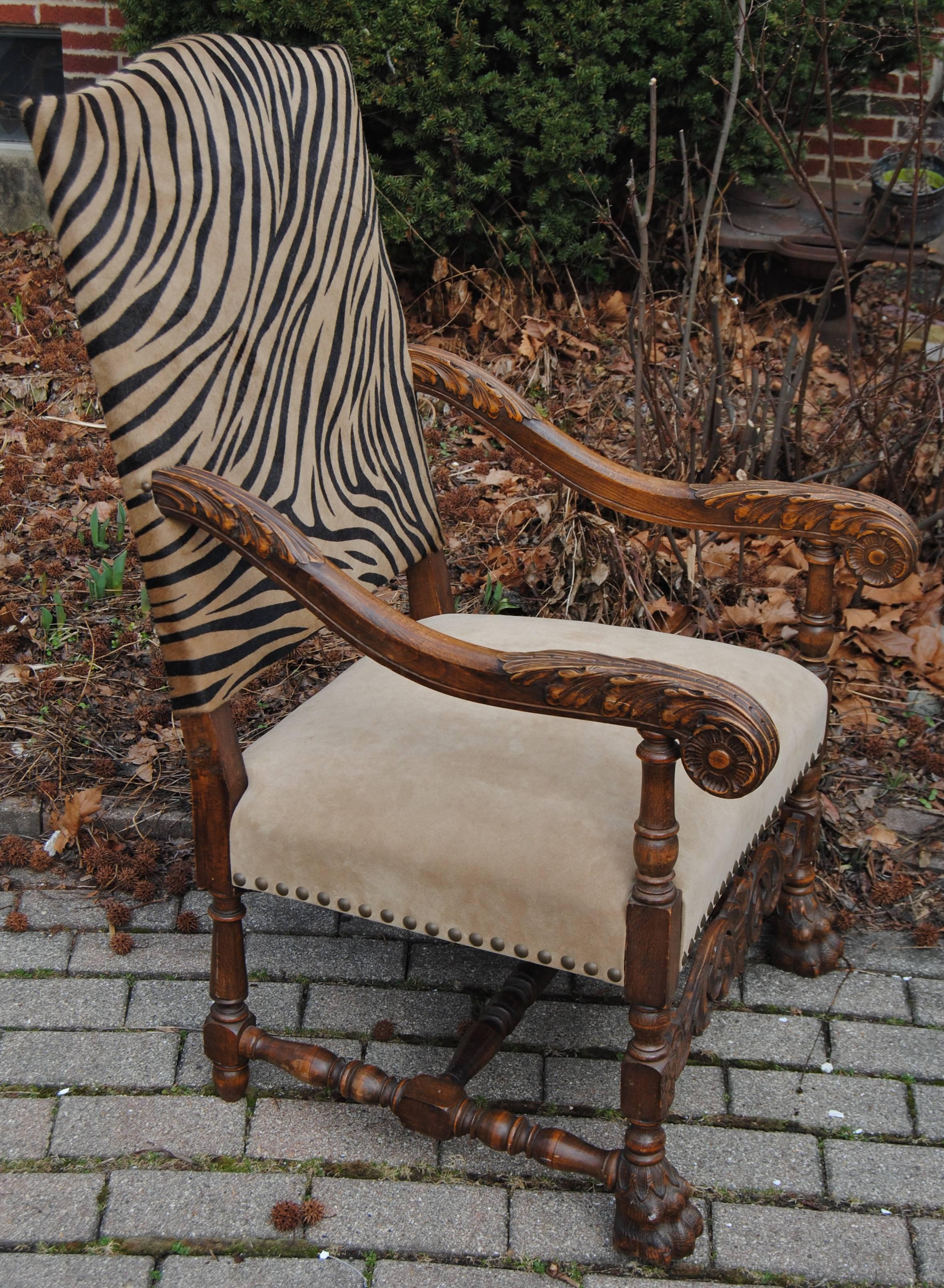 Antique European hand-carved armchair newly upholstered in Edelman faux zebra cowhide with Edelman solid suede leather seat. Wood has original finish in good condition.