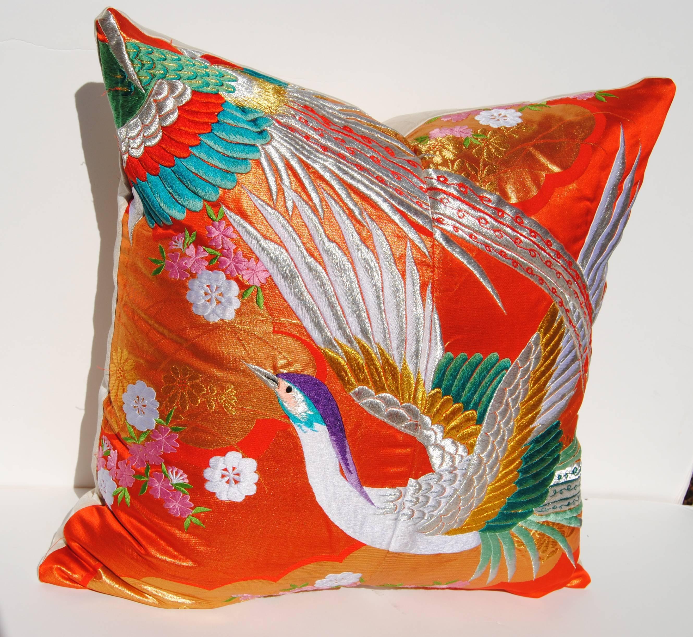 Custom pillow cut from a vintage Japanese silk Uchikake, the traditional wedding kimono. The silk is embroidered with metallic and silk threads in vibrant colors. Pillow is backed in Scalamandre silk/linen, filled with an insert of 50/50 down and