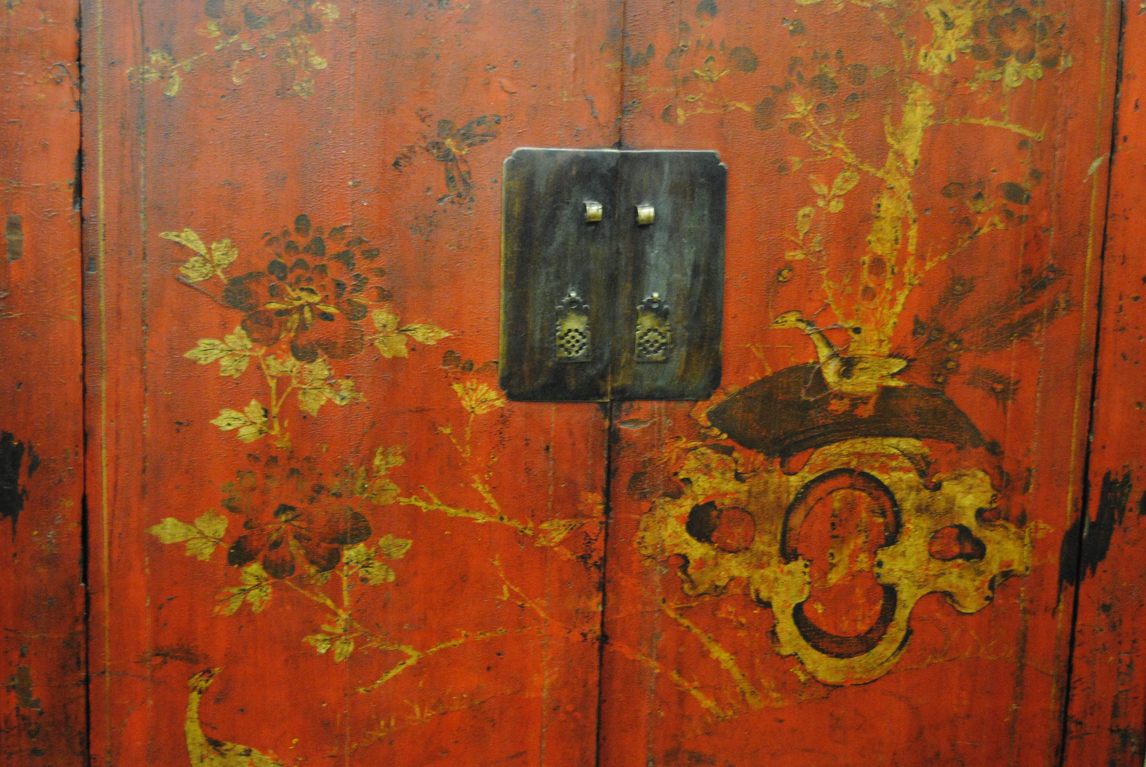 Late 19th century Chinese two-door wedding armoire from Shanxi province.  The Asian cabinet has original painted design and lacquer. Two inner shelves and a lower storage area in the bottom of the cabinet.