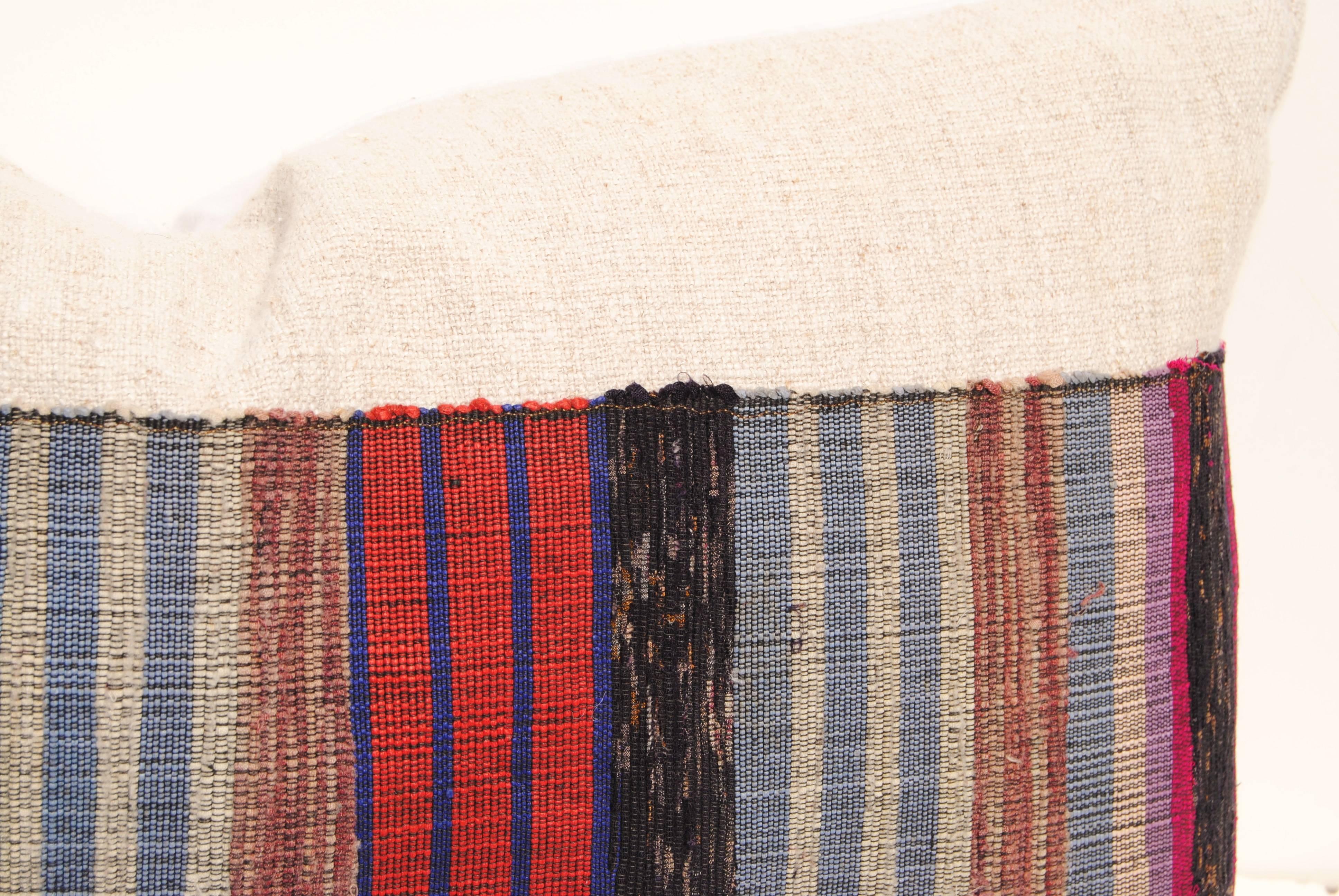 Custom pillow cut from a vintage Japanese hand loomed sakiori obi. Sakiori is the Japanese technique of Fine rag weaving. Remnants of silk and assorted textiles are cut into thin strips and rewoven into obis. This vintage obi is backed with hand