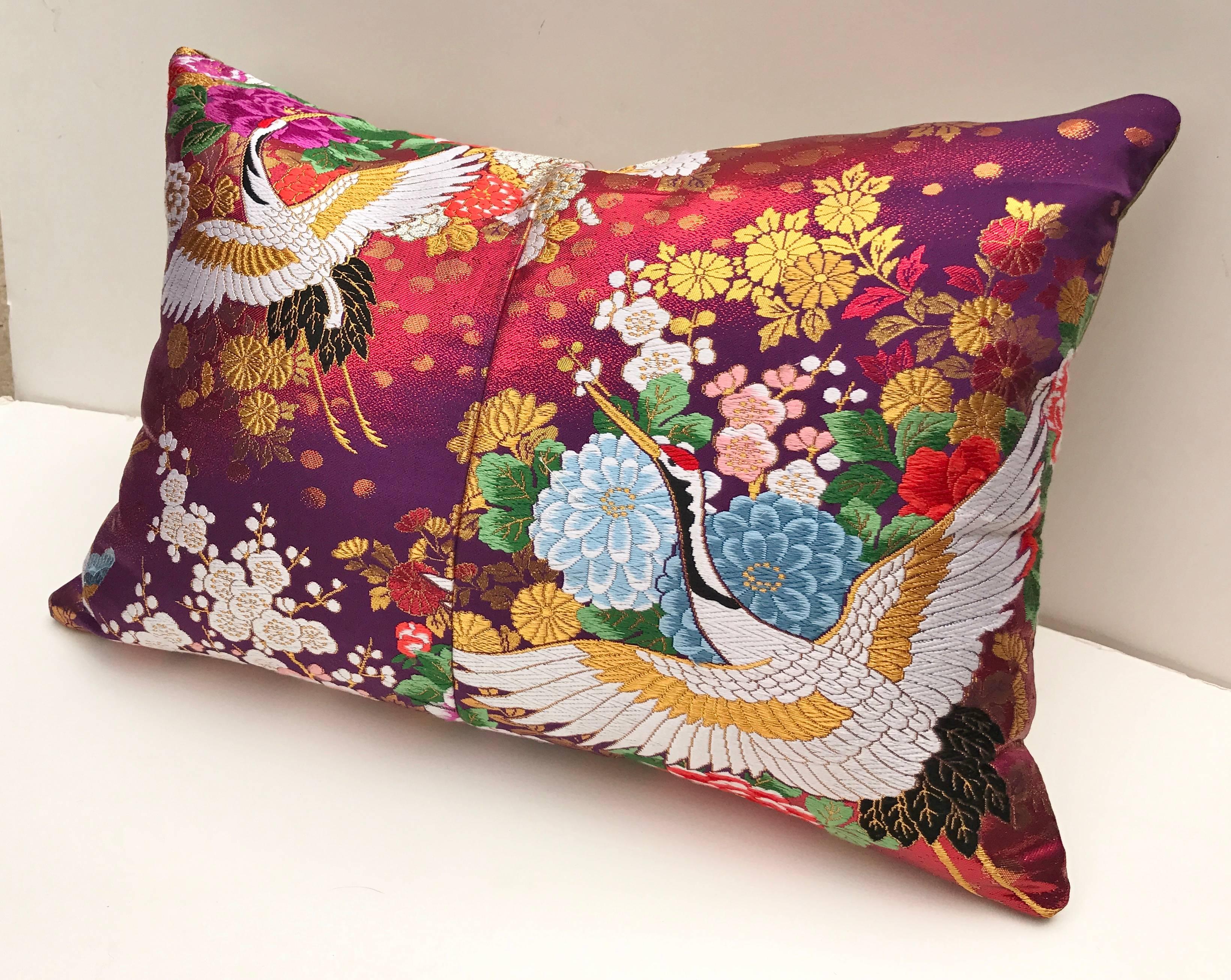 Custom pillow cut from a vintage woven silk Japanese uchikake, the traditional wedding kimono. The pillow has vibrant color with traditional Japanese designs. It is backed in a putty color silk, filled with a 100% down insert and hand-sewn closed.