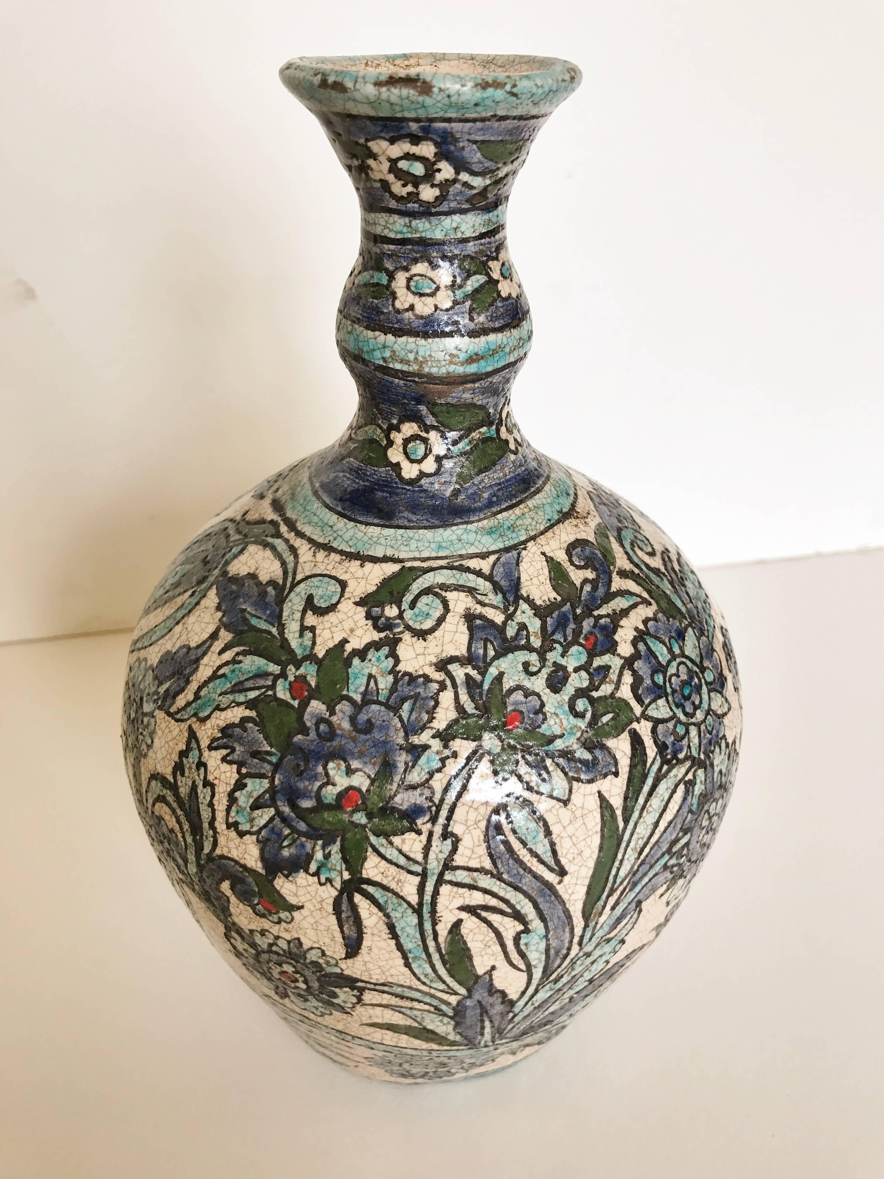 Two vintage hand-painted blue and white floral pottery vases from Syria. Late 20th century pottery with traditional designs. Larger vase is 5.5