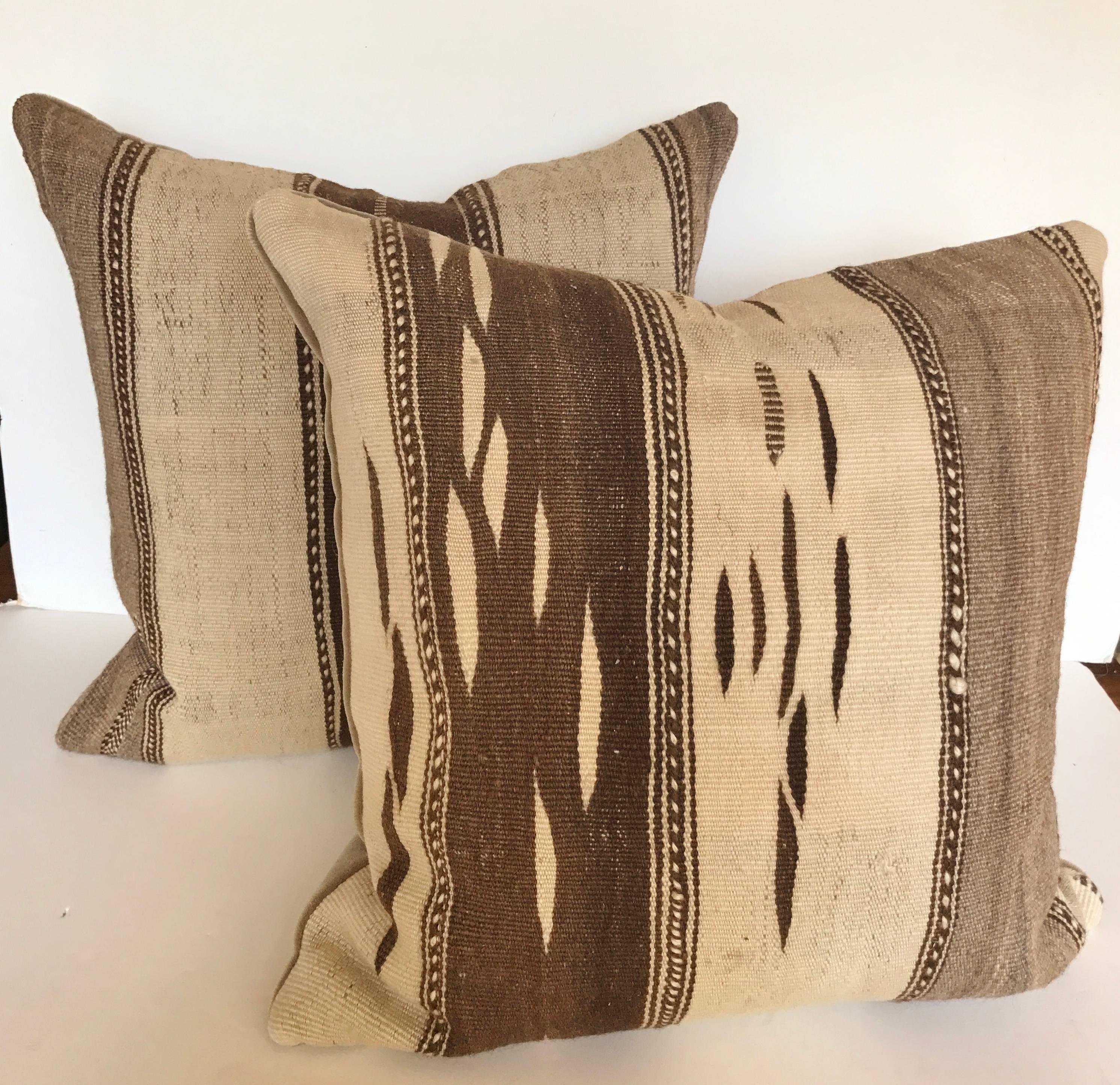 Custom pillow cut from a vintage hand loomed wool Moroccan Ourika kilim from the High Atlas Mountains.  Wool is soft and lustrous and design is consistent with the traditional Ourika Valley motifs.  Wool slugs and minor repairs are found in the flat