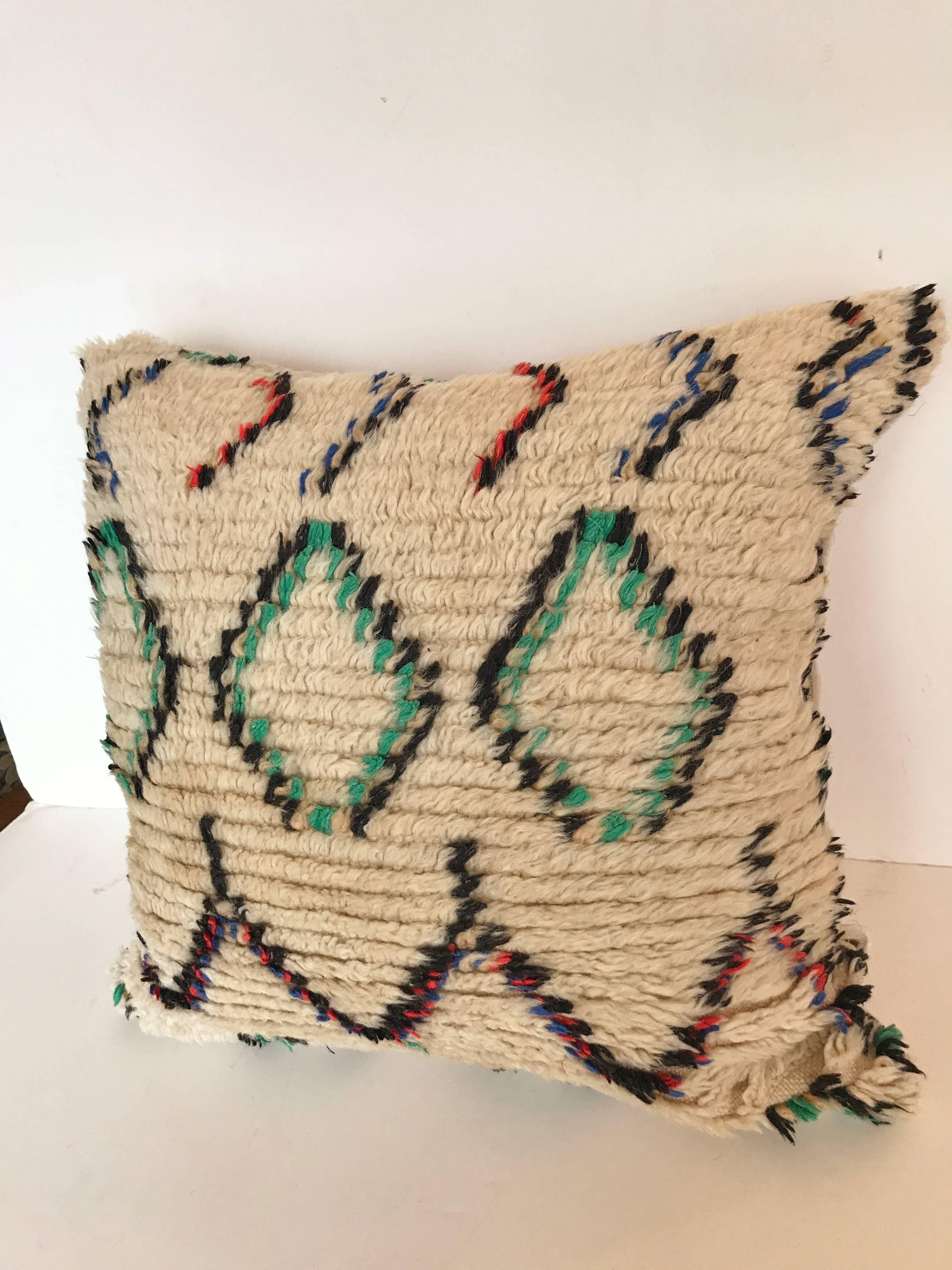 Custom Pillow cut from a vintage Moroccan Beni Ouarain hand loomed wool Berber rug from the Atlas Mountains.  Wool is soft and lustrous with all natural dyes.  Pillow is backed in mohair, filled with an insert of 50/50 down and feathers and hand