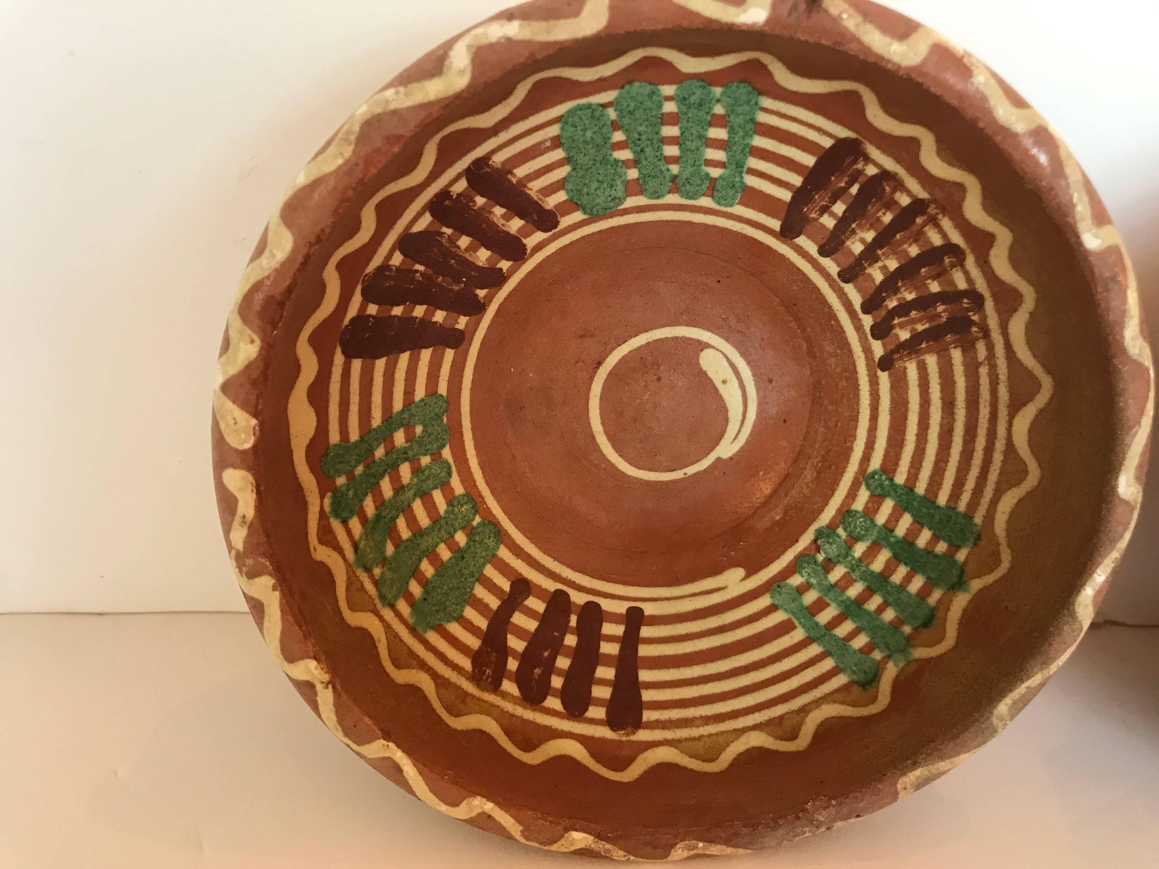 Transylvania vintage pottery from Romania. Hand-painted Folk Art designs on redware pottery.