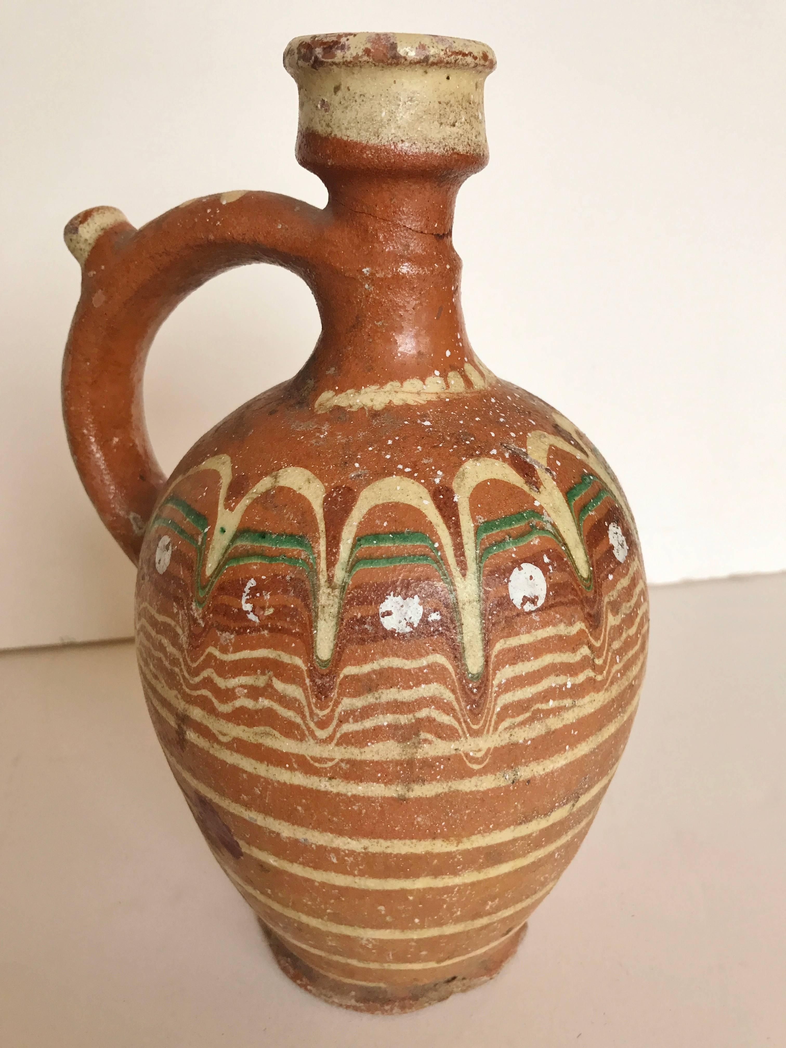 Vintage redware pottery from Transylvania.  Hand painted designs from Romania,  Decorative Folk Art.  Carafe is one of a kind for decorative use.