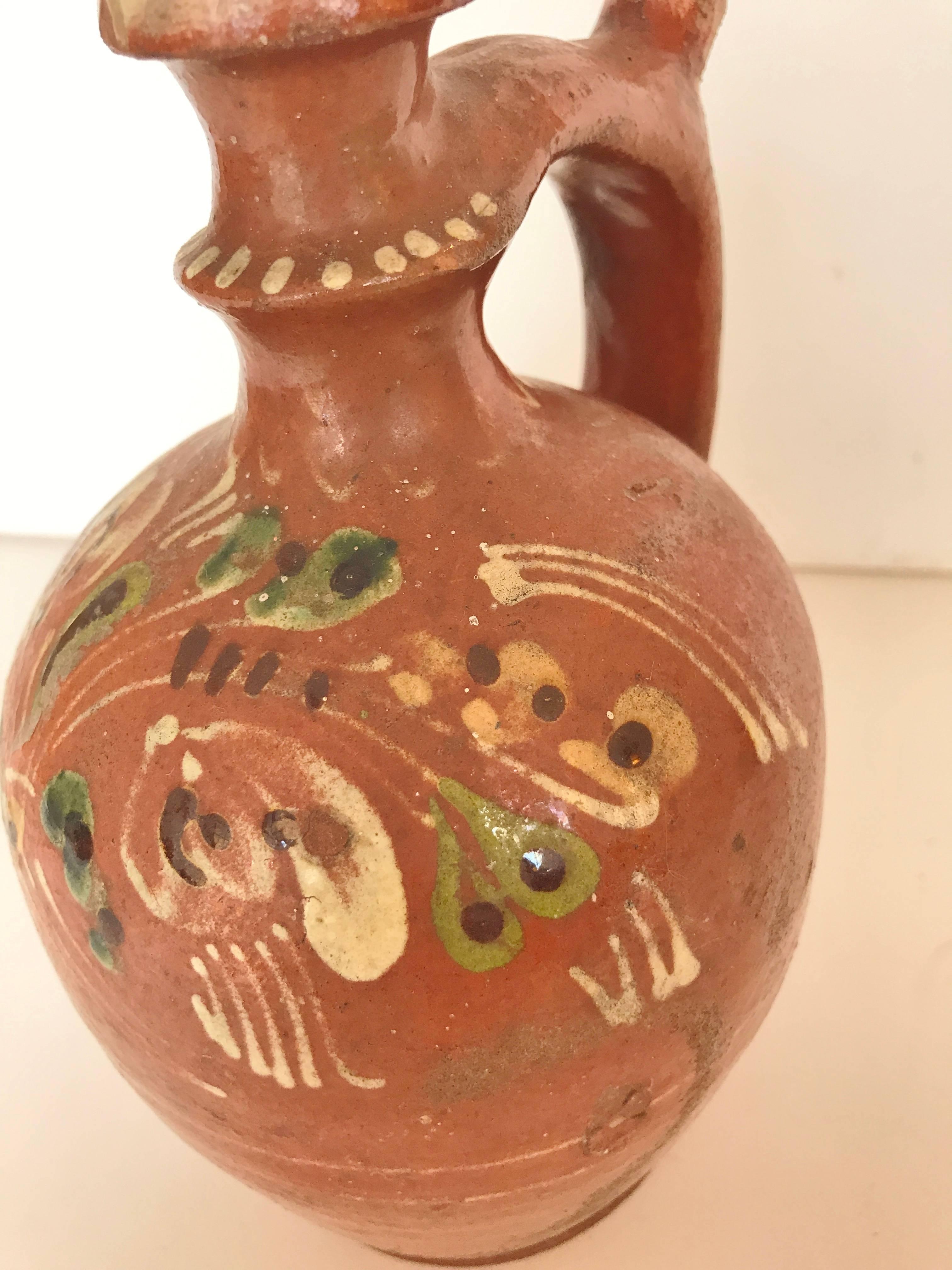 Vintage Romanian terra-cotta redware pottery with splatter glaze patterns.  From provincial eastern Europe, Transylvania.  Hand-painted carafe, jug, pot, traditional rustic pottery.  Folk art.