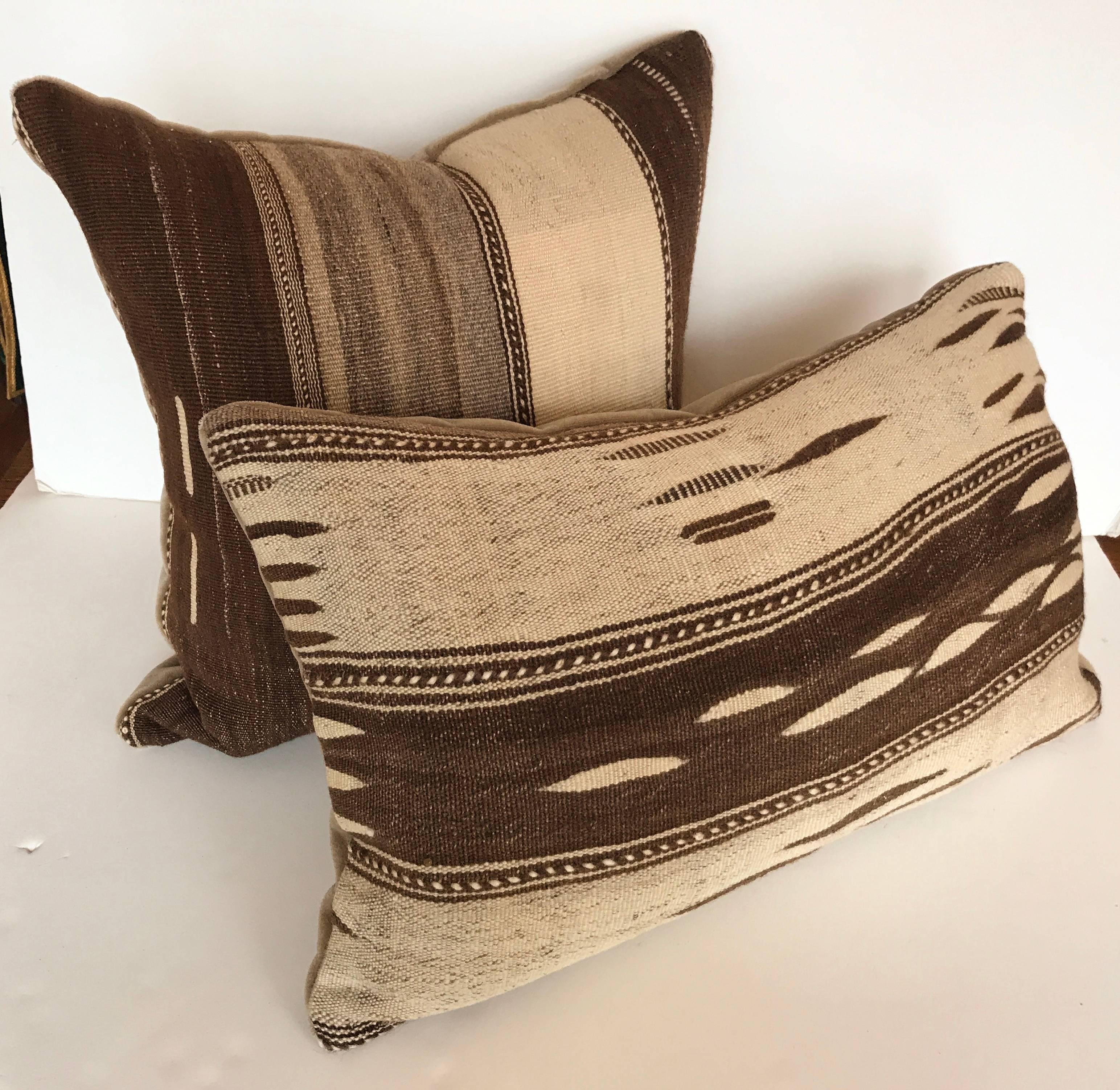 Custom pillow cut from a vintage wool Moroccan Ourika rug from the High Atlas Mountains.  Wool is soft and lustrous with all natural colors.  Designs are exclusive to the Ourika Valley.  Pillow is backed in mohair, filled with an insert of 50/50