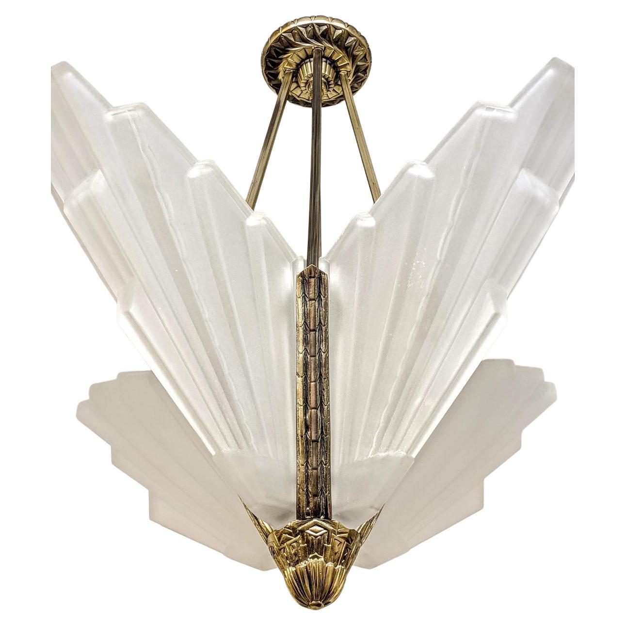 A French Art Deco bronze geometric design chandelier created by the French master 