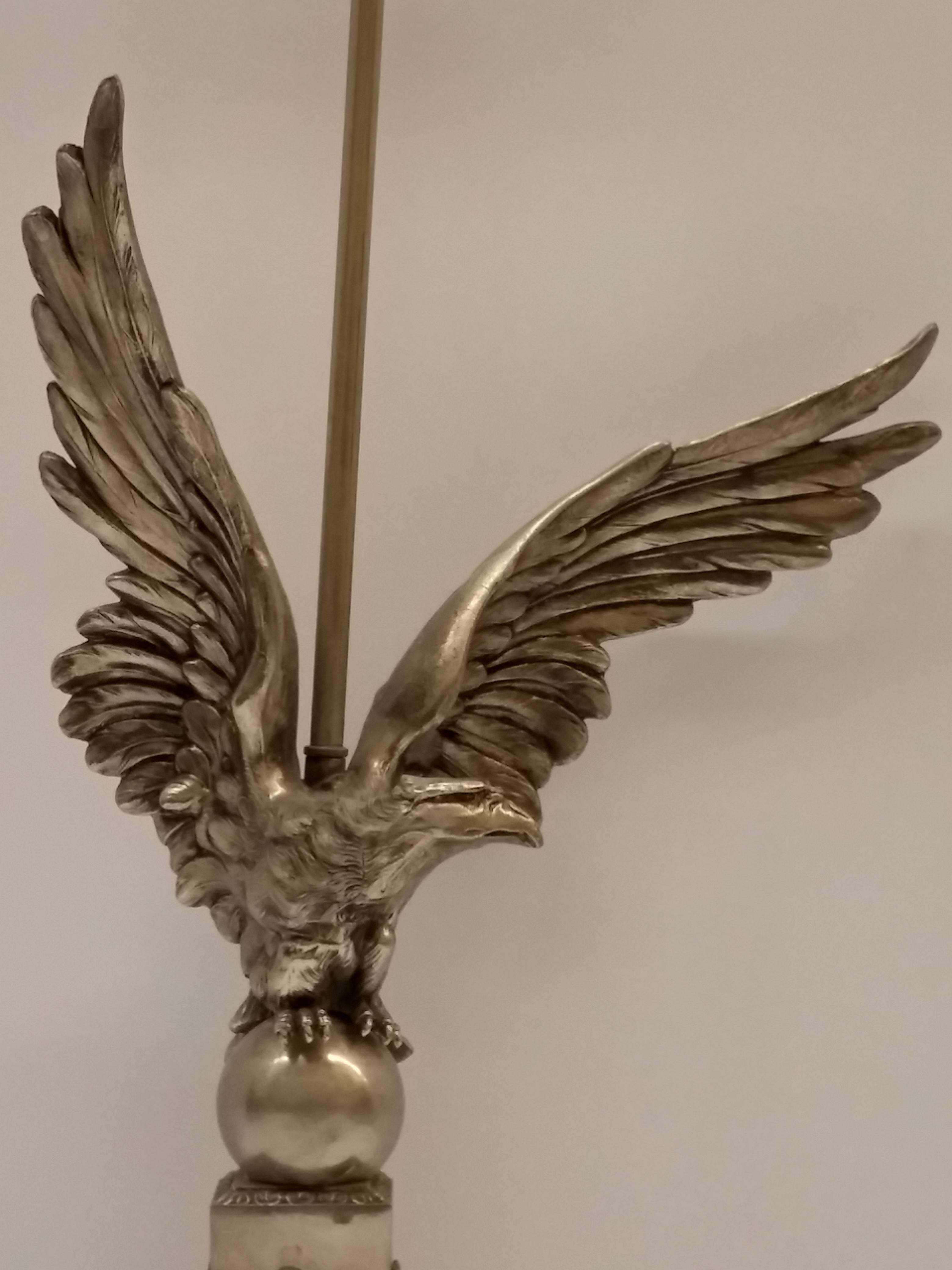 A French Art Deco Eagle motif table, desk lamp in nickeled bronze with light Black Patina in great condition. Complimentary drop-off to the tri-state area. We are the rare source that specializes exclusively in French Art Deco for over three