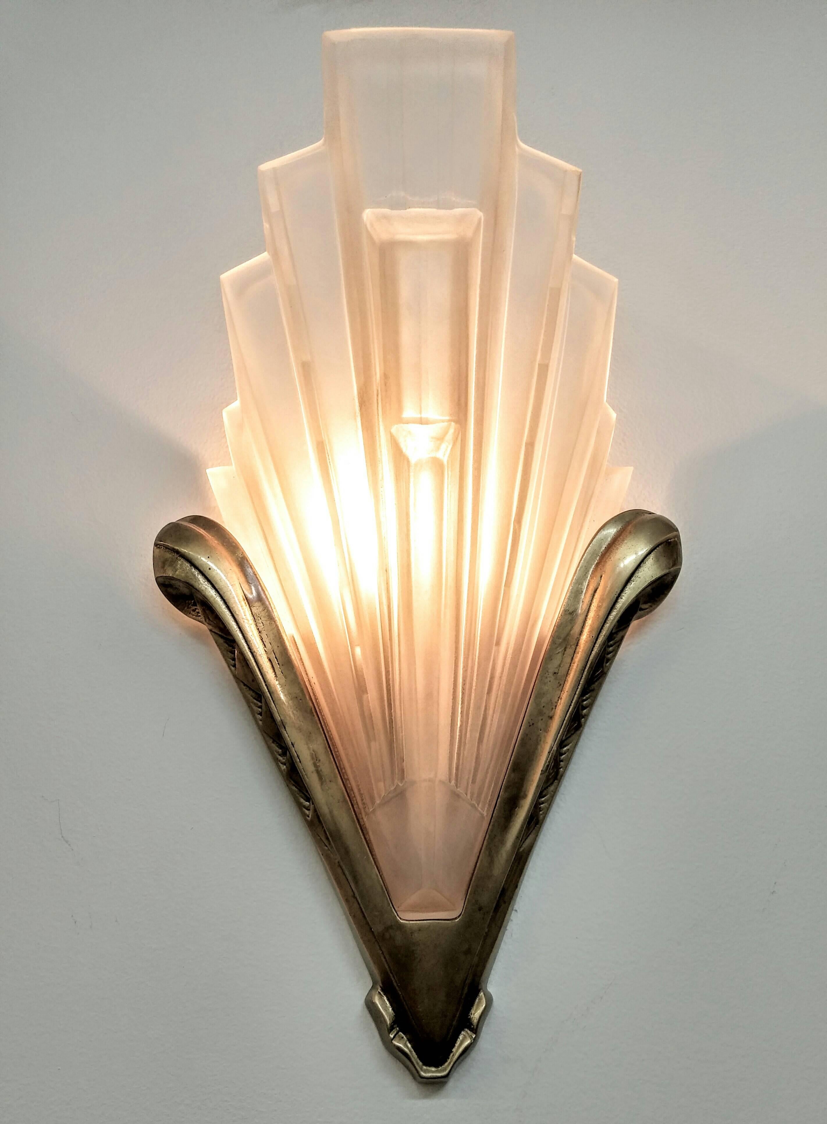 
A pair of French Art Deco wall sconces by French artist “ Sabino 