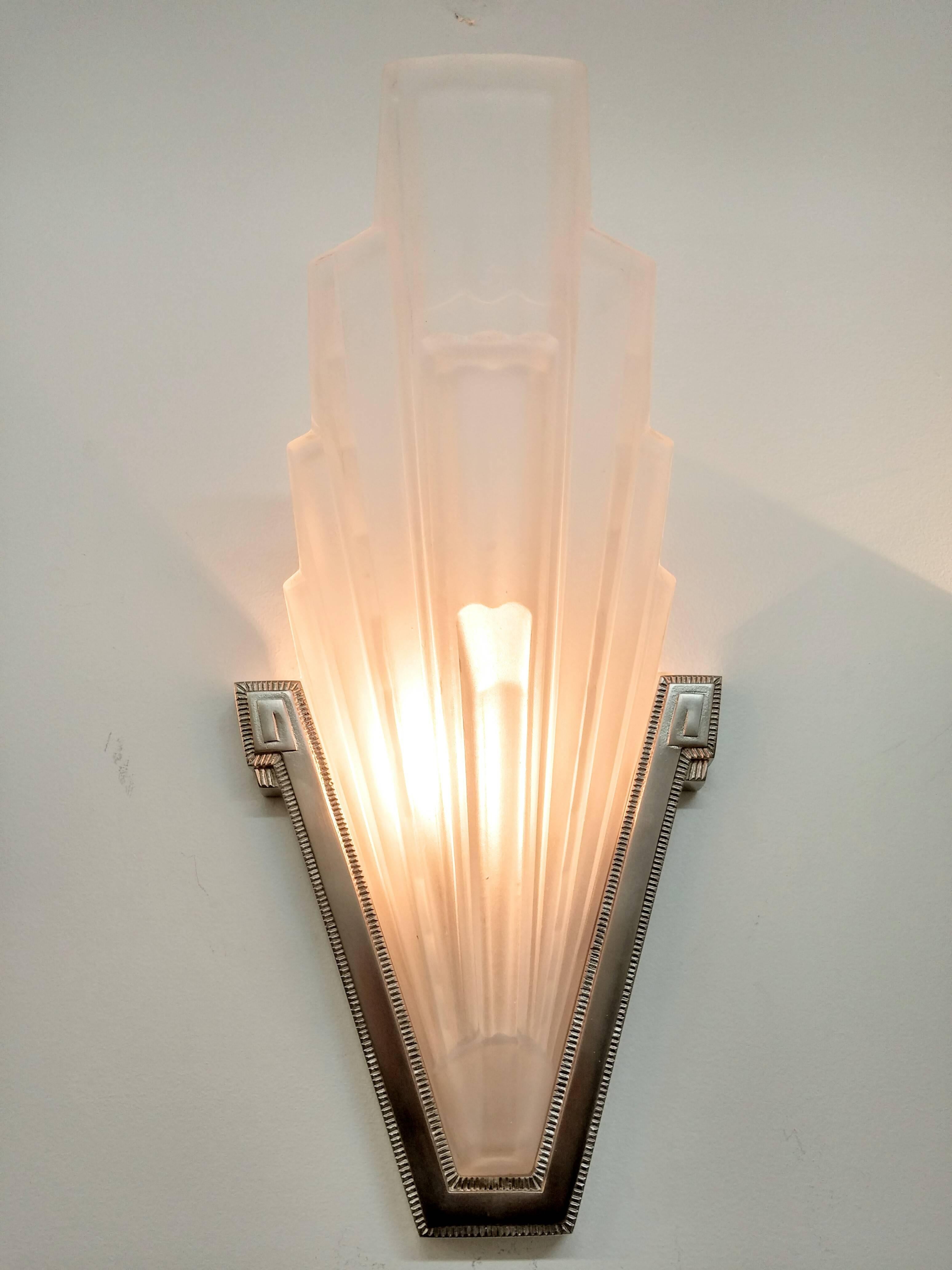 
A pair of French Art Deco wall sconces created by French artist 
