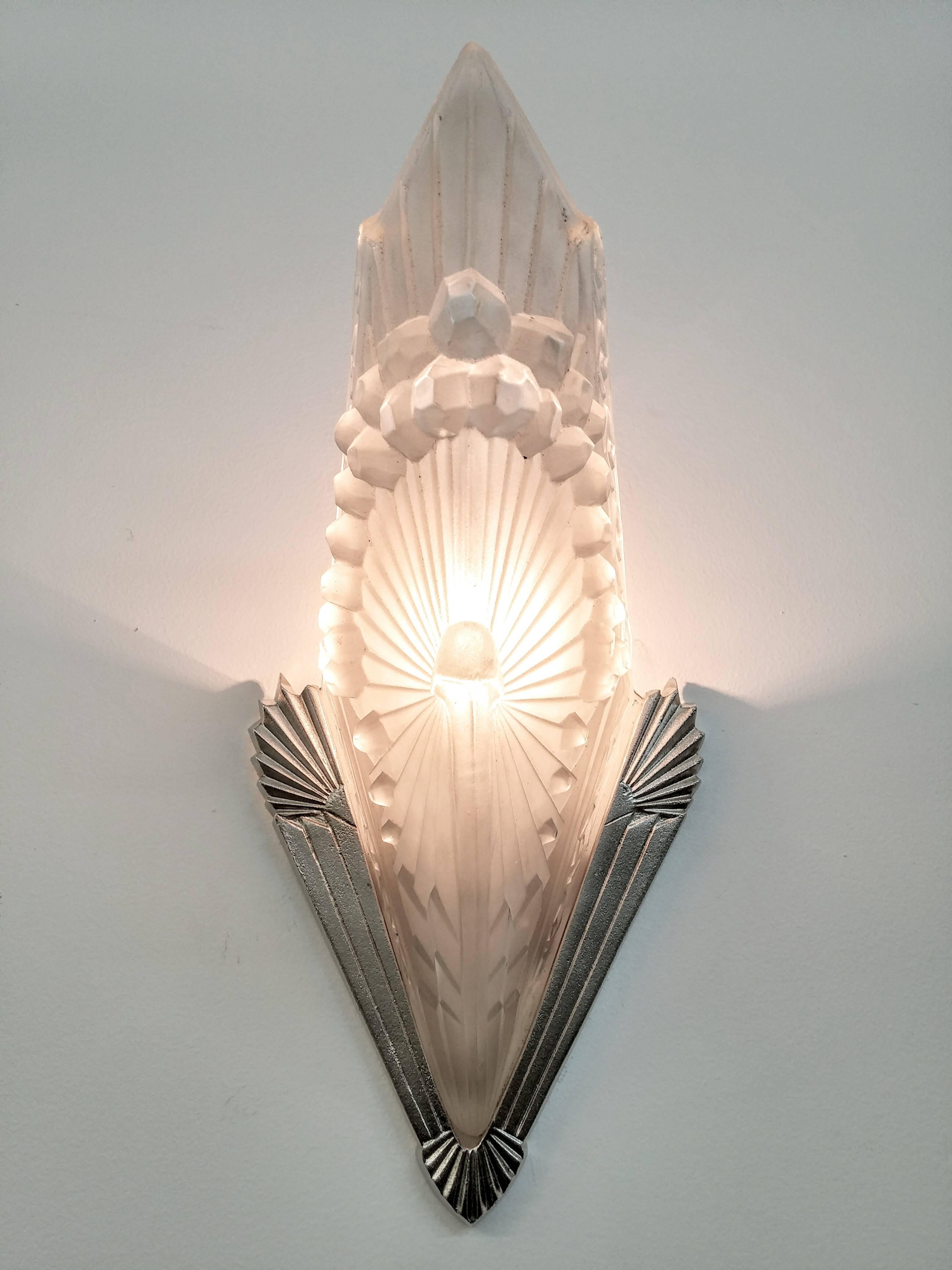 Stunning pair of French Art Deco sconces were created by the French artist 