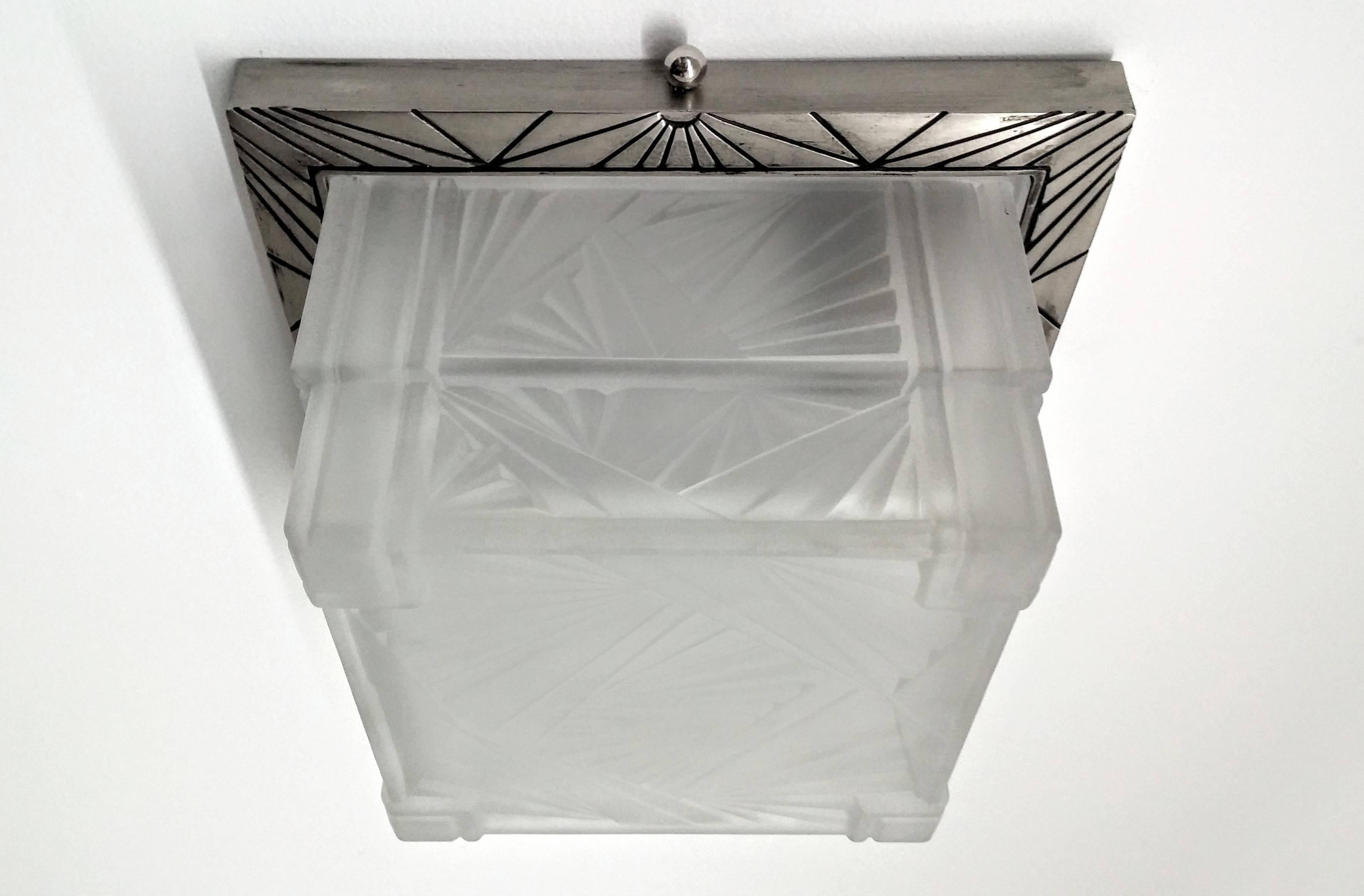 
A French Art Deco Square shaped Flush Mount or sconces was created by the French artist 