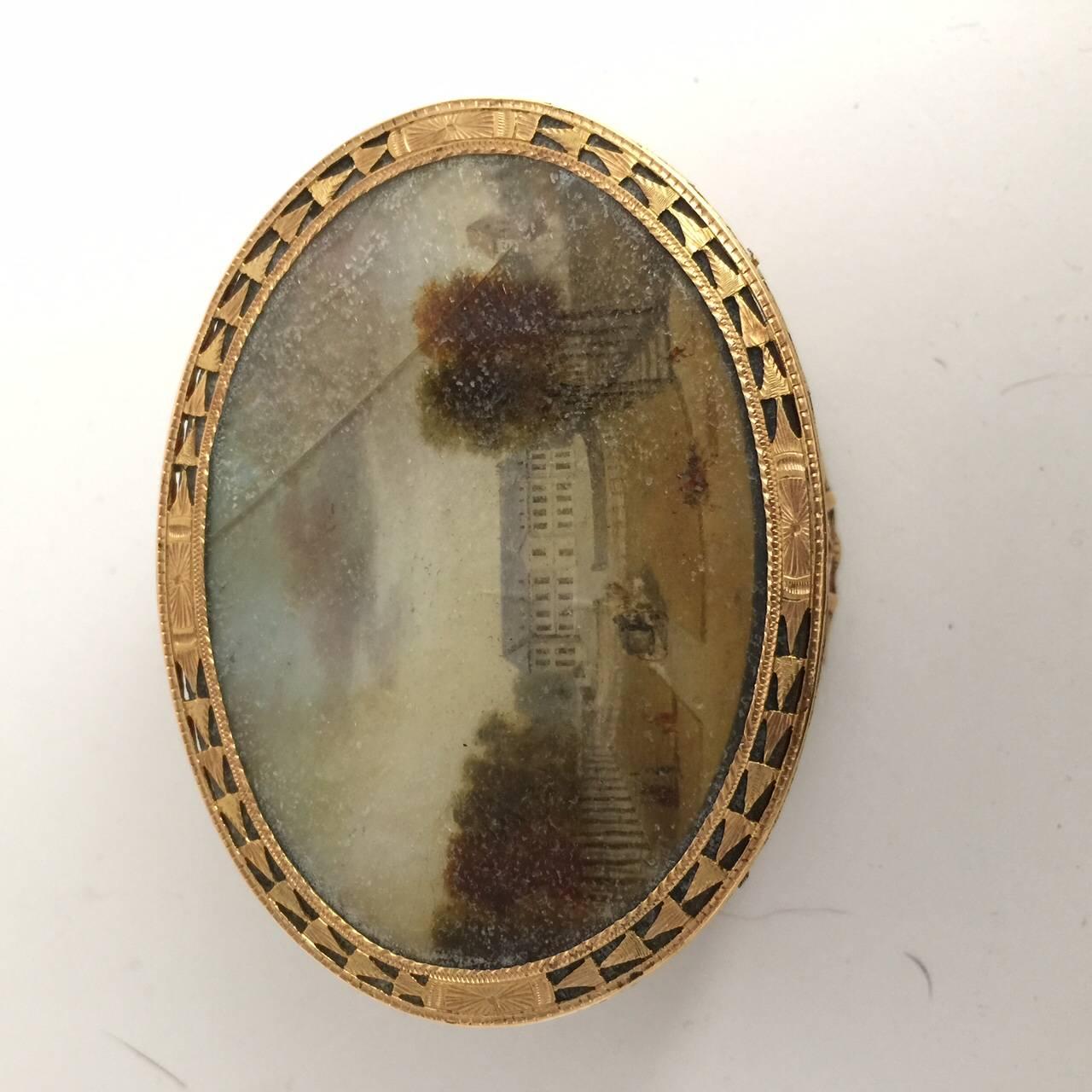 The cover and base inset with gouache miniatures of the front and back of a chateau, signed Andre inv. with tortoiseshell lined interior
maker's mark JG cross between, Paris, 1762-1768.