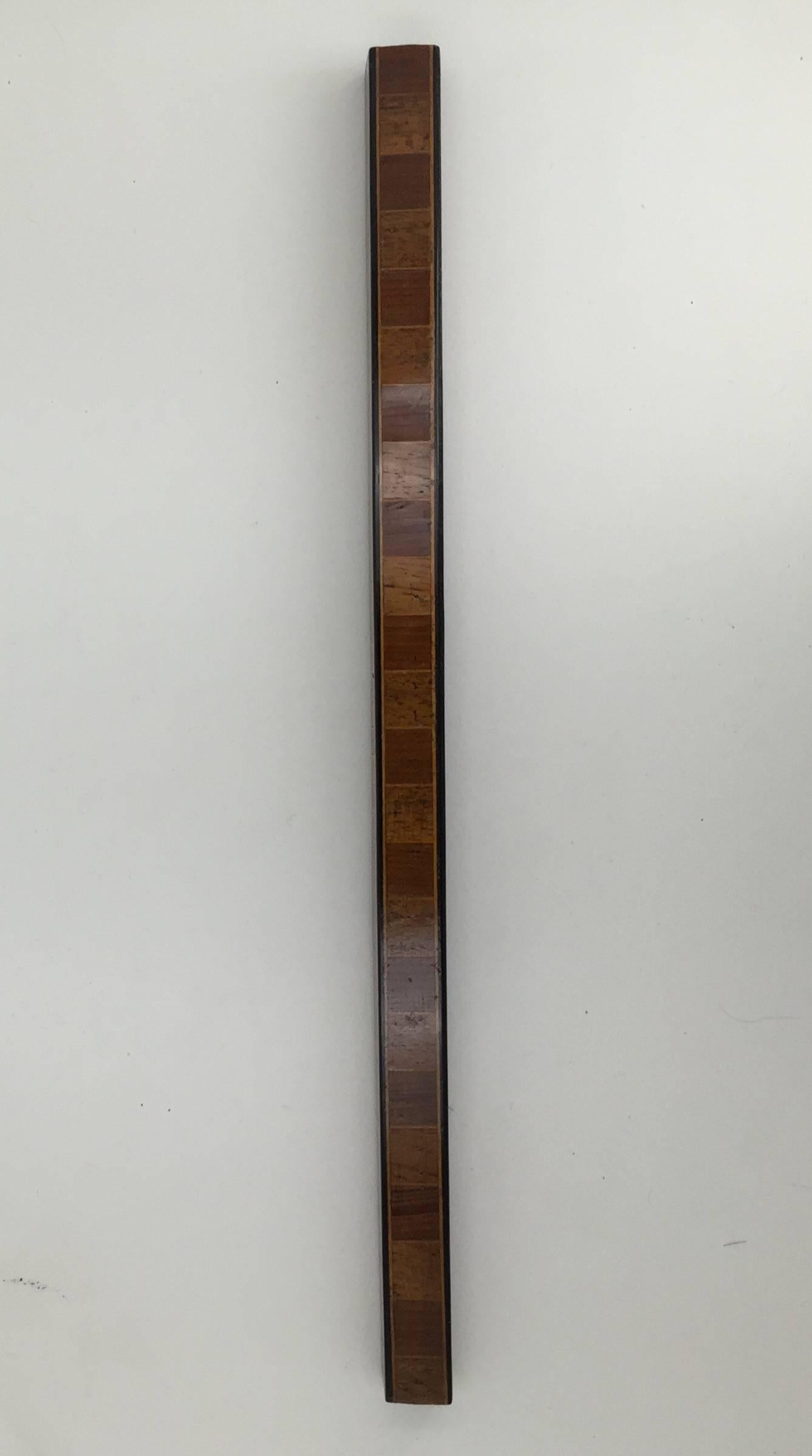 The ruler with differing scales on each side.