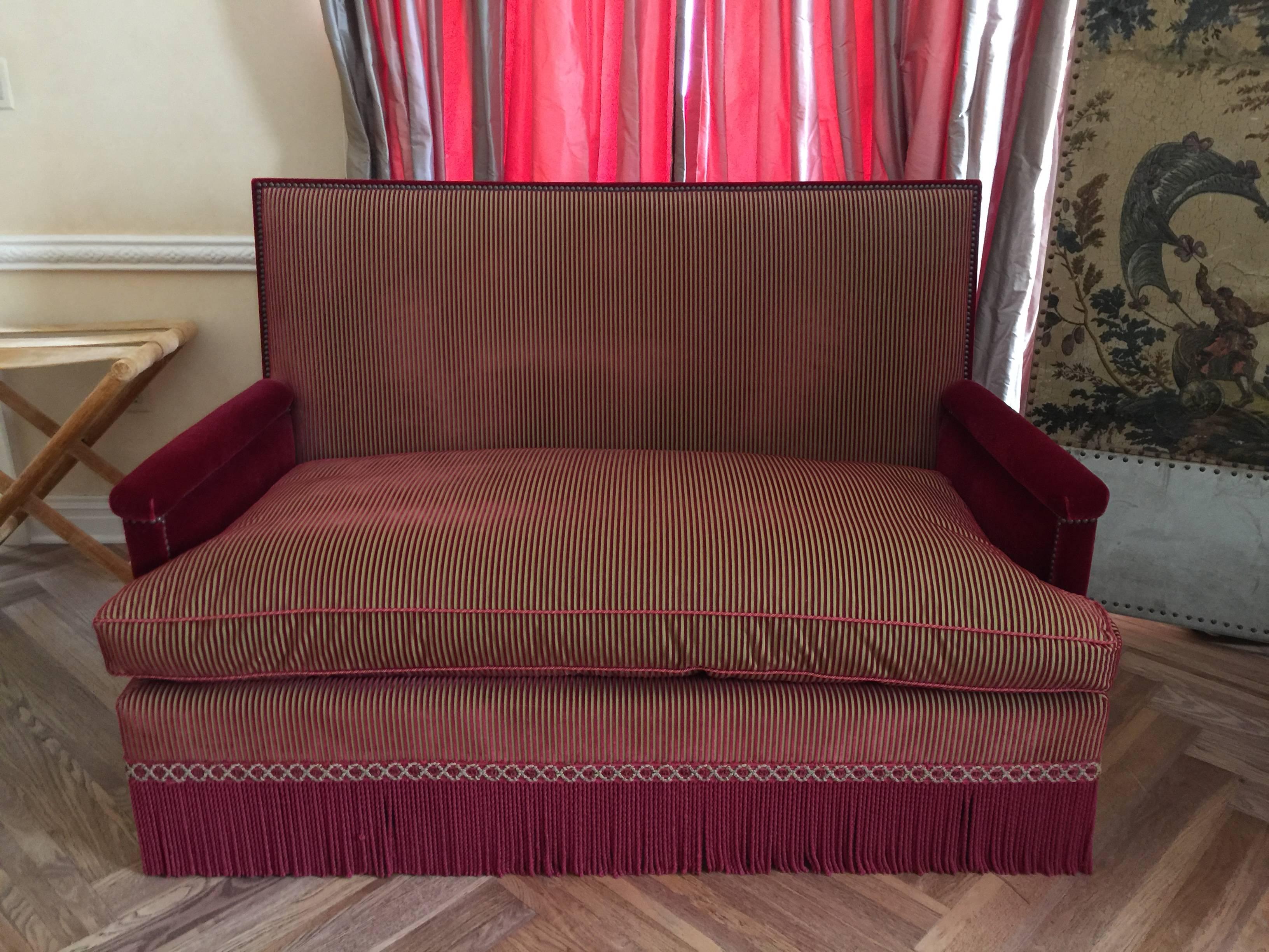 The upholstery with studs, gimp and fringe, with velvet back and sides.