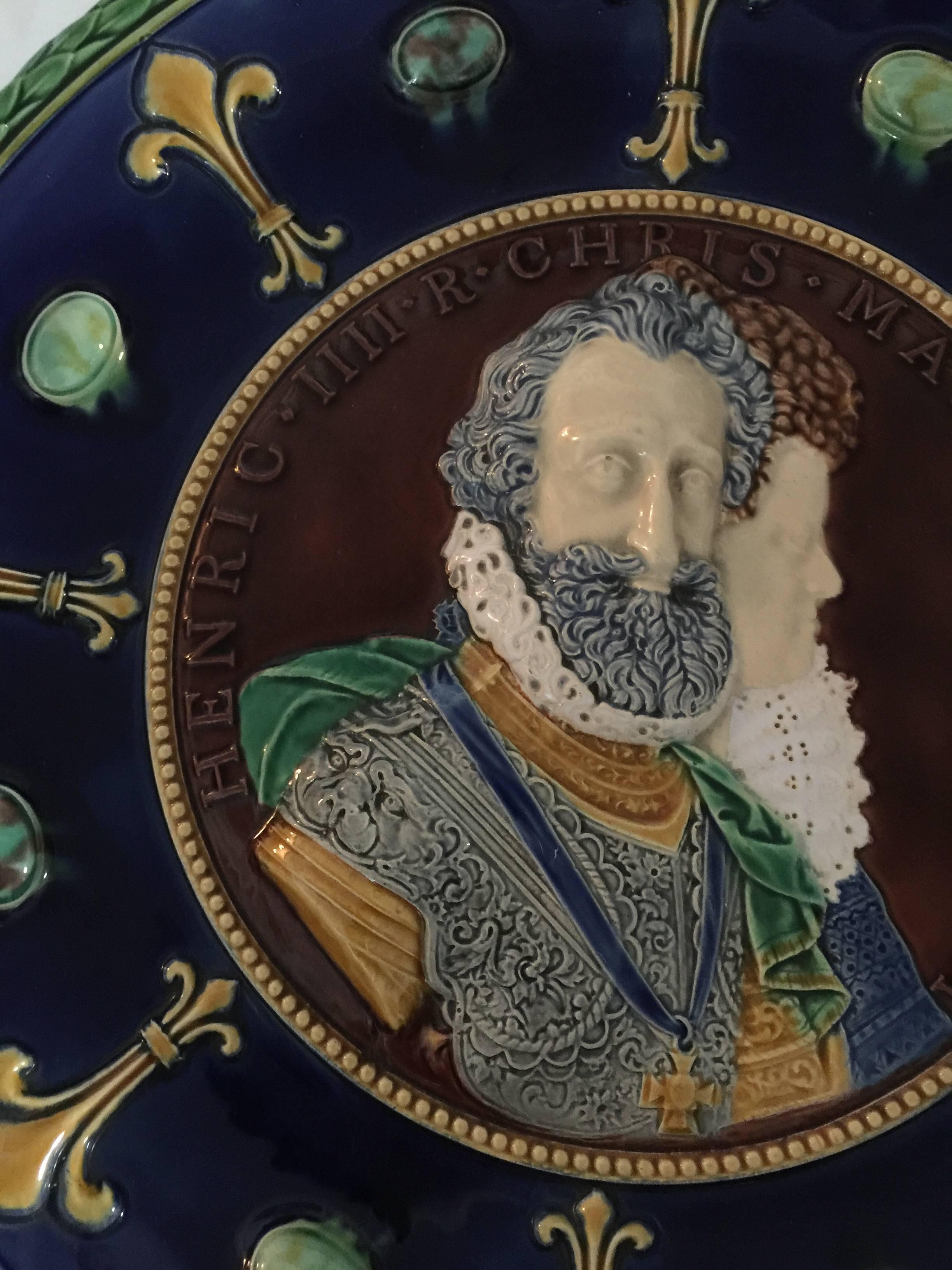 Molded in high relief with a 3/4 length portrait of Henri IV and profile of Maria de Medici, after Guillaume Dupre, circa 1605. inscribed 'HENRIC IIII R CHRIS MARIA AVGVSTA, with in a dark blue ground of yellow fleur de lys and green oval bosses.