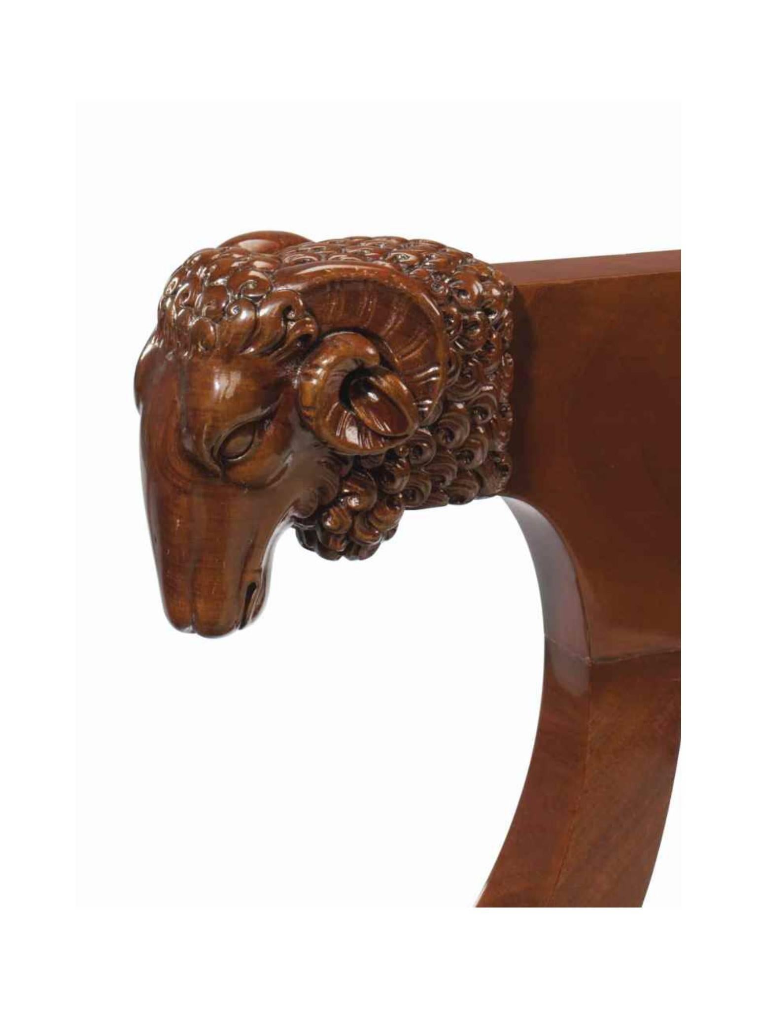 The early 19th century desk chair with ram's head arms and turned legs, is attributable to Jacob Desmalter and dates to circa 1805.