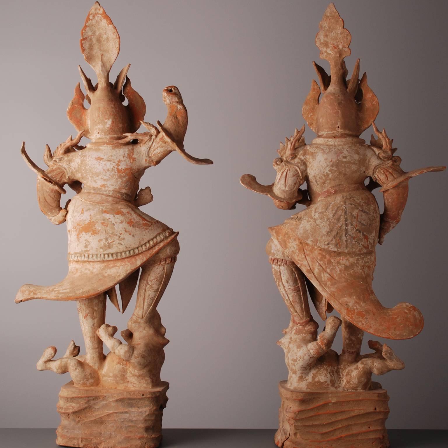These guardians were placed near the entrance of a burial chamber to protect the deceased from evil spirits. As guardians they wear a heavy suit of armor, have scary faces and trample evils spirits. They are fairy tale figures!

 