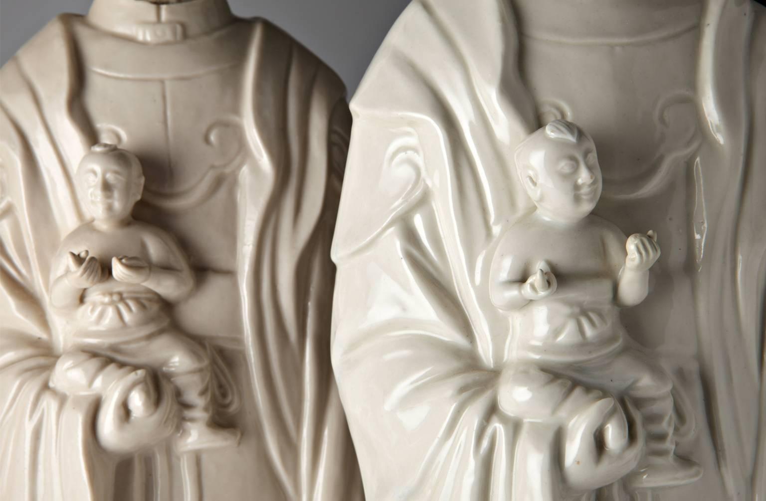 Chinese Export Pair of Chinese Blanc de Chine Porcelain Figures of Guanyin Songzi For Sale