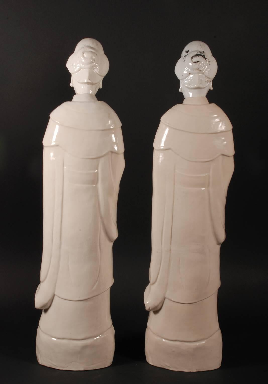 Pair of Chinese Blanc de Chine Porcelain Figures of Guanyin Songzi In Distressed Condition For Sale In 's-Hertogenbosch, NL