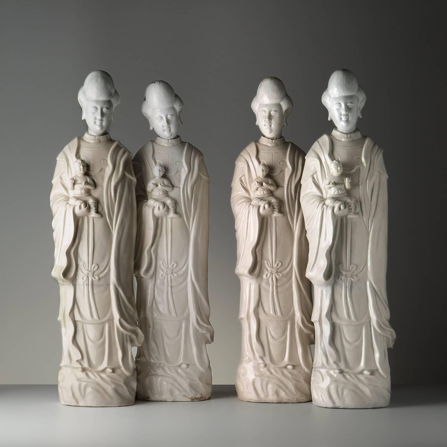 Pair of Chinese Blanc de Chine Porcelain Figures of Guanyin Songzi For Sale 1