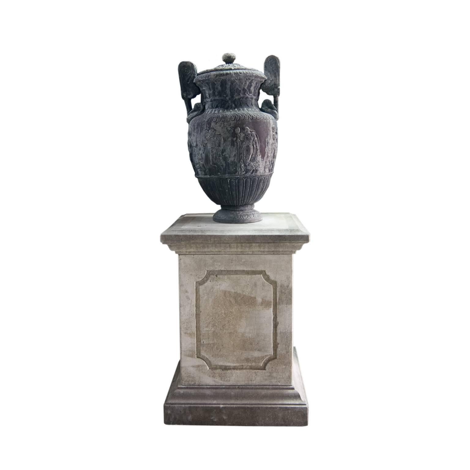 Pair of Thomas Hope urns, England 19th century. Similar can be found in black basalt in the Louvre, Paris. These Hope urns provide a classical architectural ornament for the garden, specialty in the UK. these lidded lead urns with lateral handles