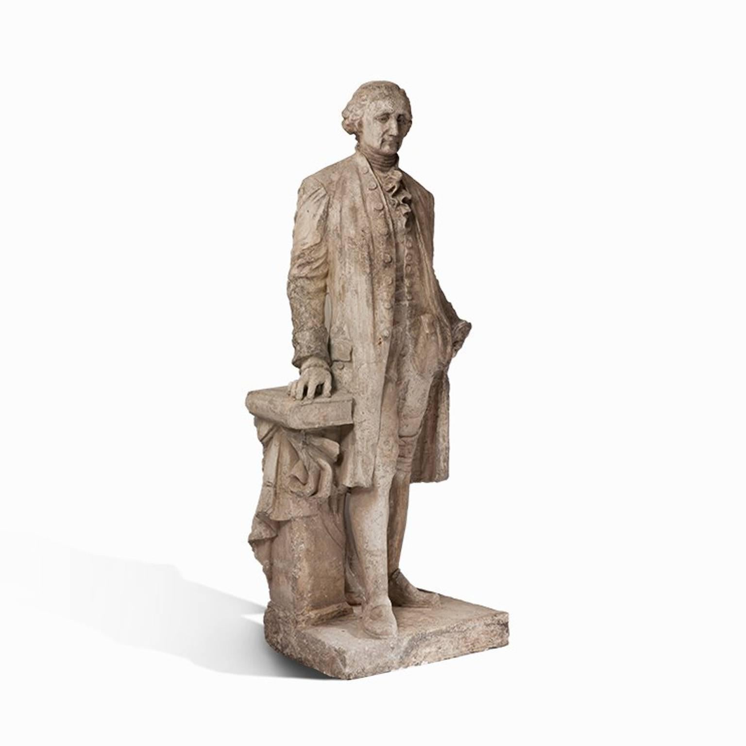 This antique statue of the first President of the United States, George Washington, is made of French plaster and is in good condition, His gaze is serious, almost stern, and his pose exudes authority and wisdom. This is emphasized by the book to