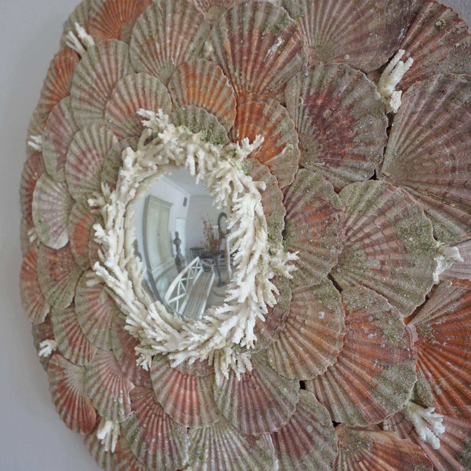 Mid 20th Century, France with small concave circular mirror surrounded with shells and coral ornaments.
