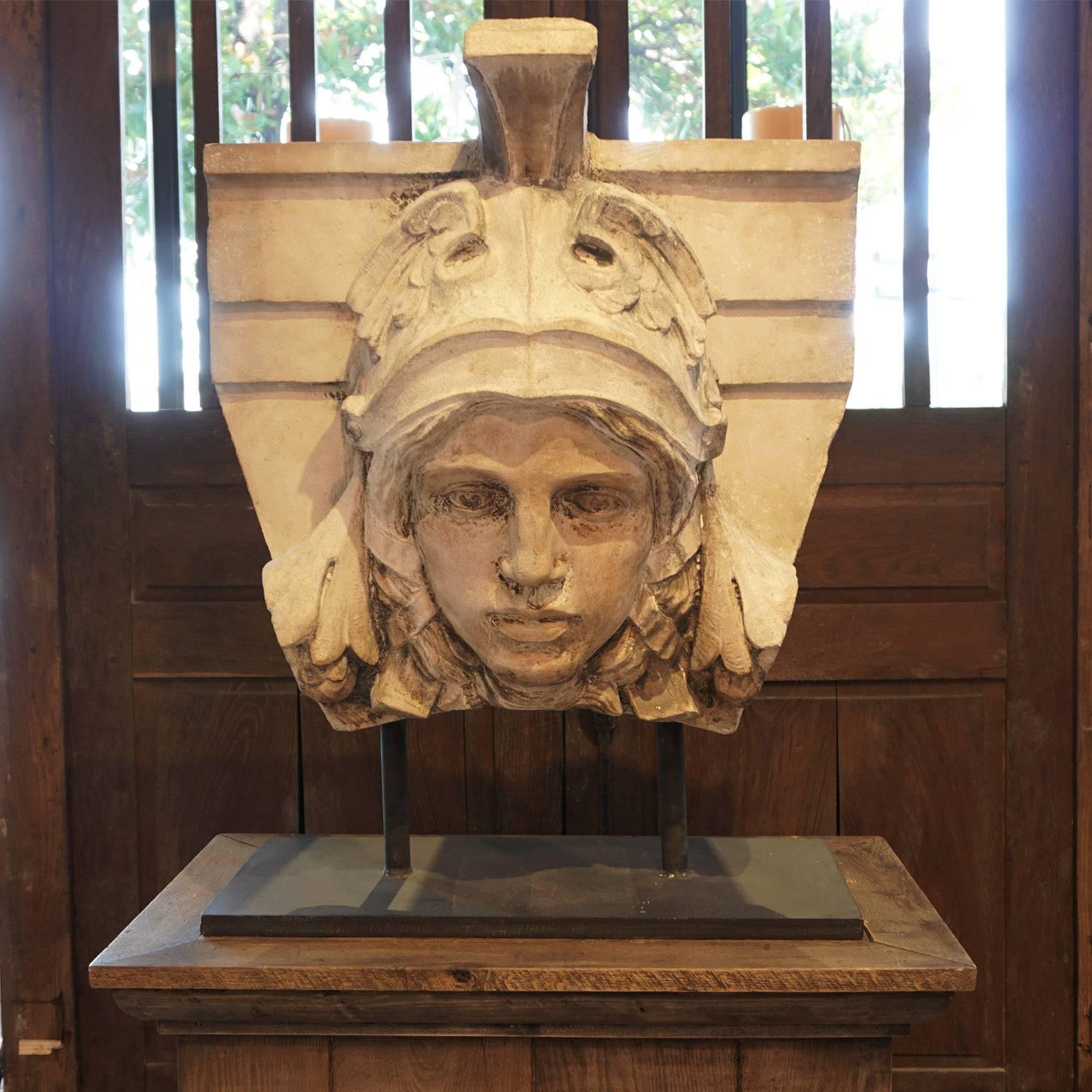 Circa 1790, A keystone of a building depicting the warrior mercury, mounted on a rectangular metal base, with an antique oak pedestal.
Prov. London England, hand-carved in Portland stone.
   