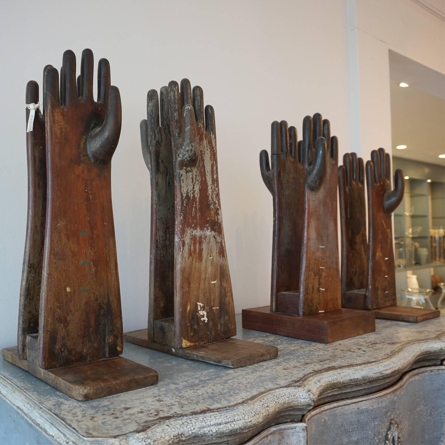 Handmade objects or art. Set of four vintage glove molds on stands (Boite A Gants Du Moule), which were mounted back to back, sizes vary.