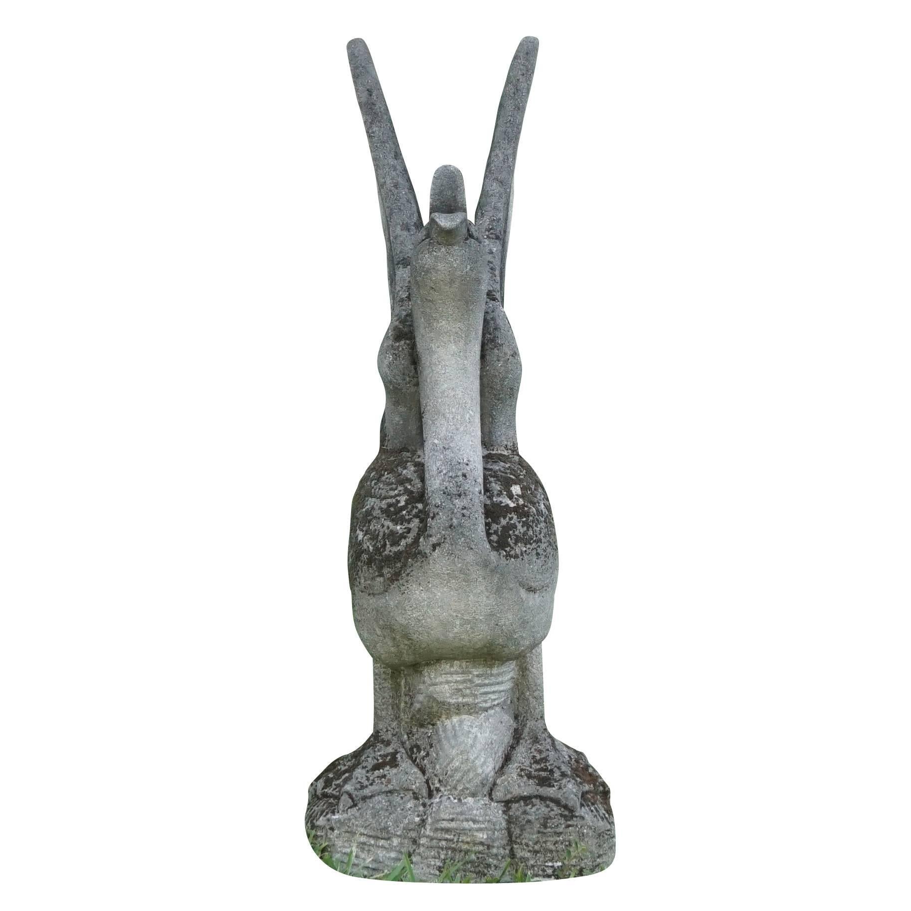A 20th century, courtship garden statue of a swan flapping its wings with an open beak. This hand-carved statue is standing on an attached base and from an estate in Friuli, Italy.
Beautifully aged patina with lichen and moss.