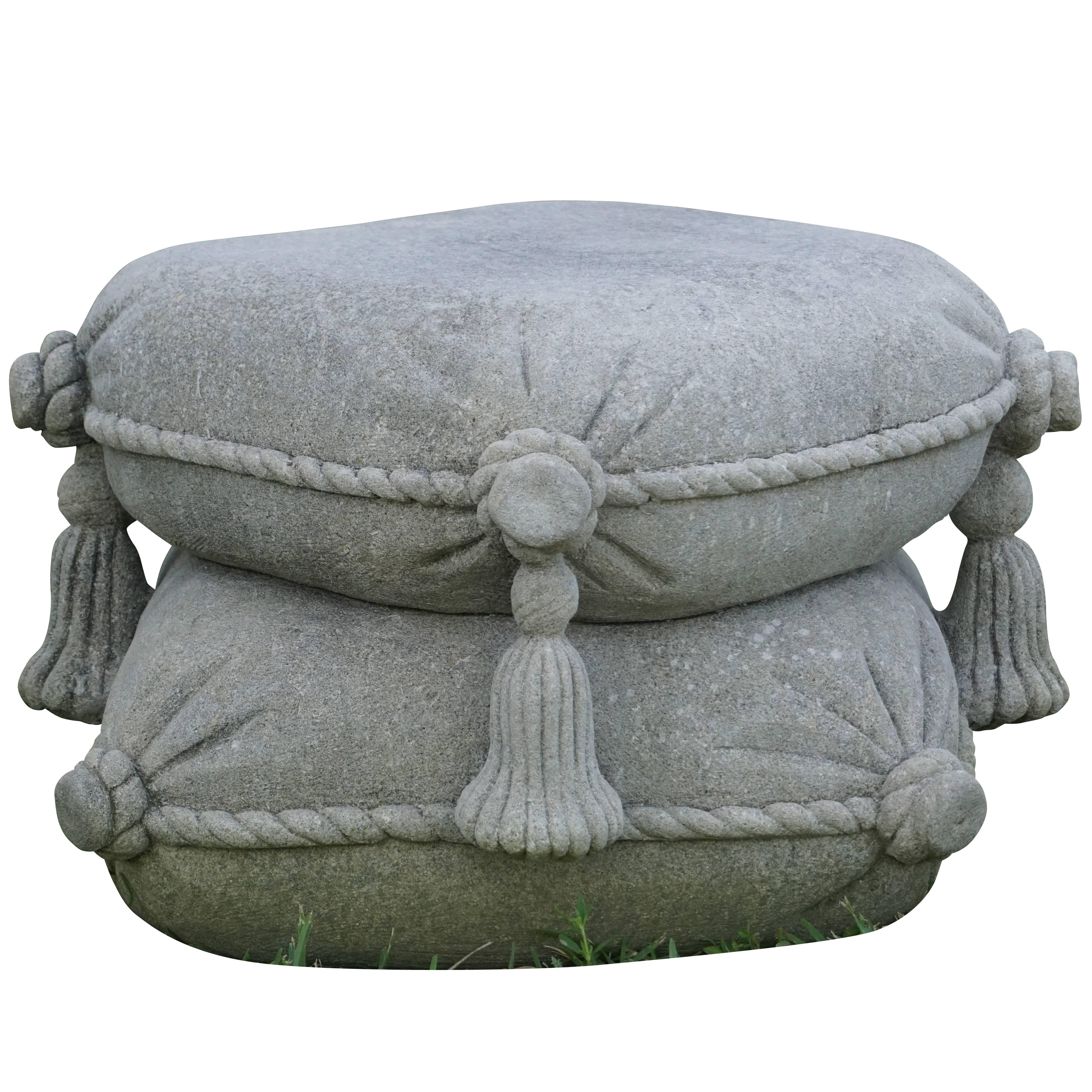 Hand-carved limestone garden seat in the shape of stacked cushions with detailed hand-sculpted rope decorations, tassels and buttons on the corners.