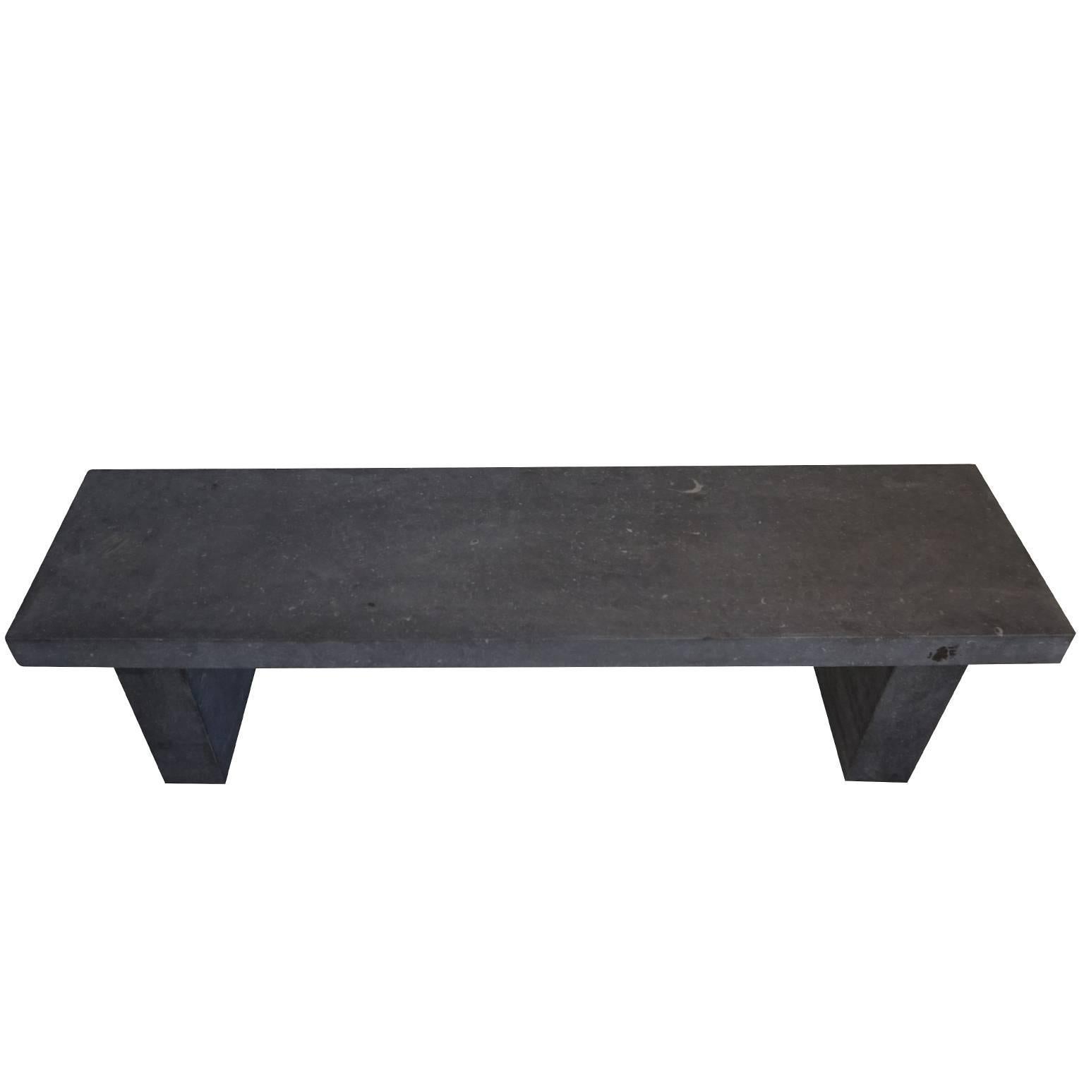 Belgian blue stone bench, designed in a clean and contemporary manner. The beautiful natural stone shows well, as the design is very so simple. Square cut with an eased edge, heavy beveled bench top with 4.5