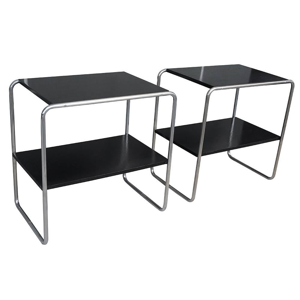 A vintage Art Deco Austrian pair of bar console tables made of handcrafted black lacquered plywood and chrome steel. Designed Marcel Breuer, in good condition. The end tables are representing the Bauhaus period. Wear consistent with age and use,
