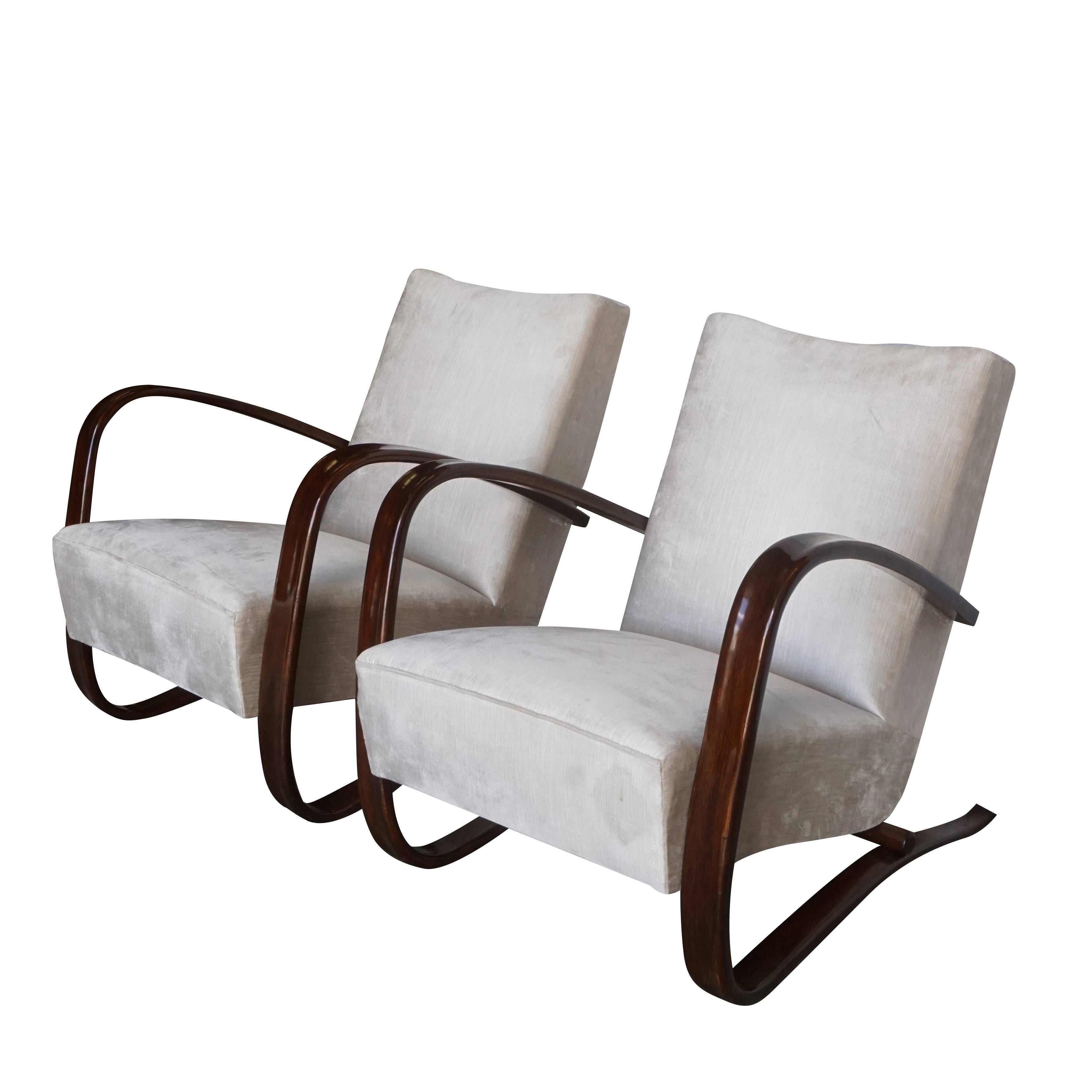 A pair of reupholstered Jindrich Halabala lounge chairs version H-269. Organically shaped bentwood frame designed by renowned German cabinet maker Thonet. The pair is in very good condition with small traces of usage, circa 1930 Czech Republic.