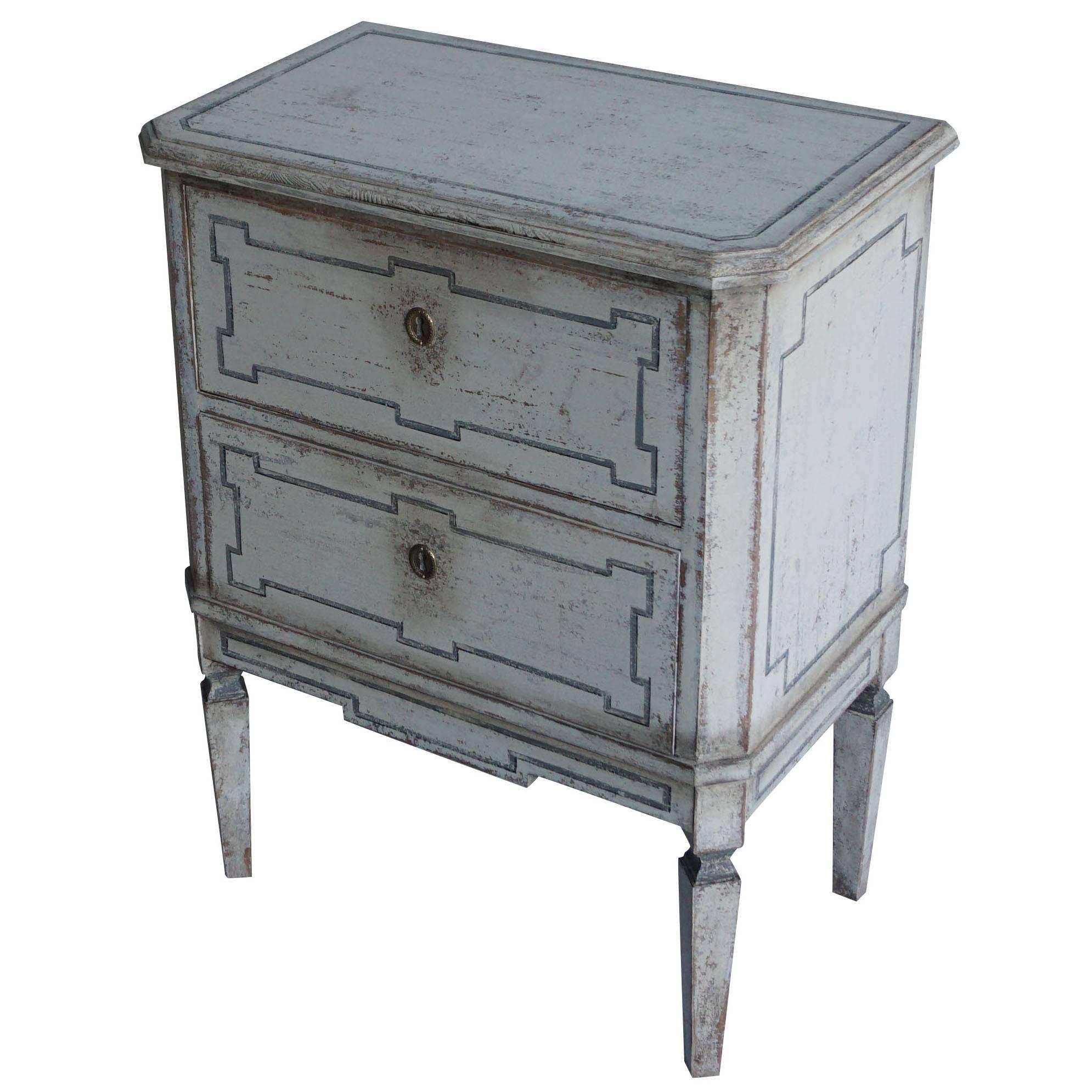 A small pair of late 19th century Gustavian painted commode chest of two drawers, slanted corners, standing on tapered legs,
circa 1880 Sweden., Scandinavia.