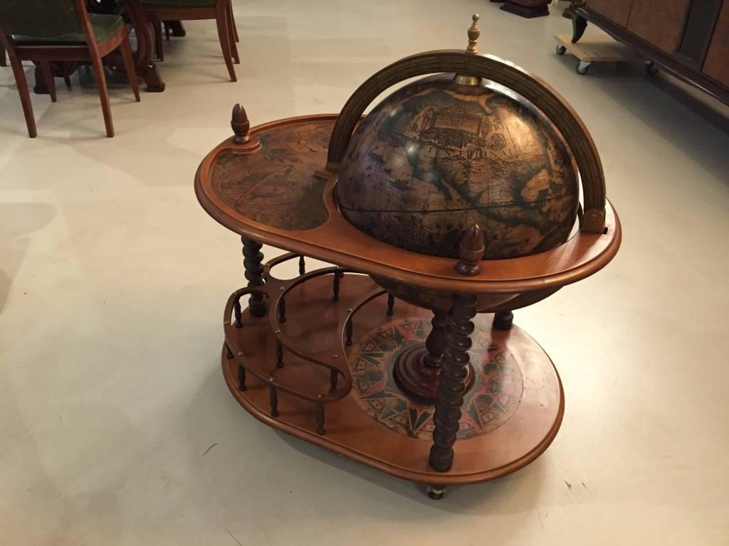 Beautiful French Mid-Century modern globe dry bar. Having pictures of Greek mythology and mythical creatures. The world globe opens to reveal a stunning dry bar with plenty of space. Perfect for any decor.