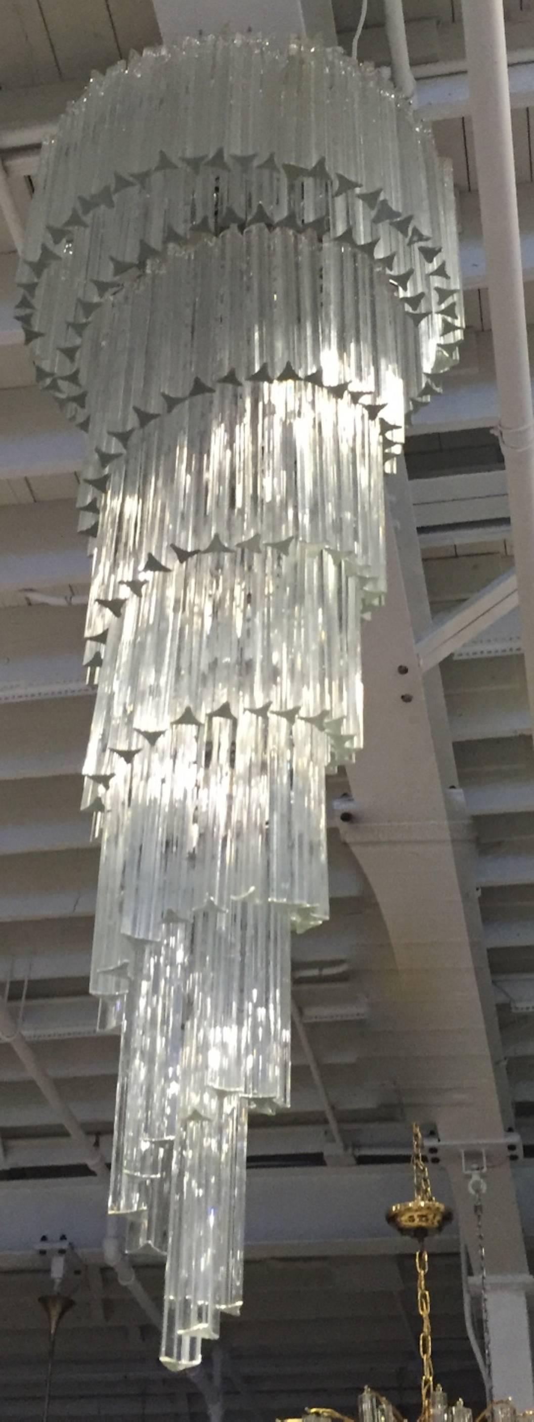 This Italian chandelier features clear Murano hand blown glass rods that cascade from the upper layer into a spiral design

 

Height: 72 inches (without chain)
Width: 24 inches
 
